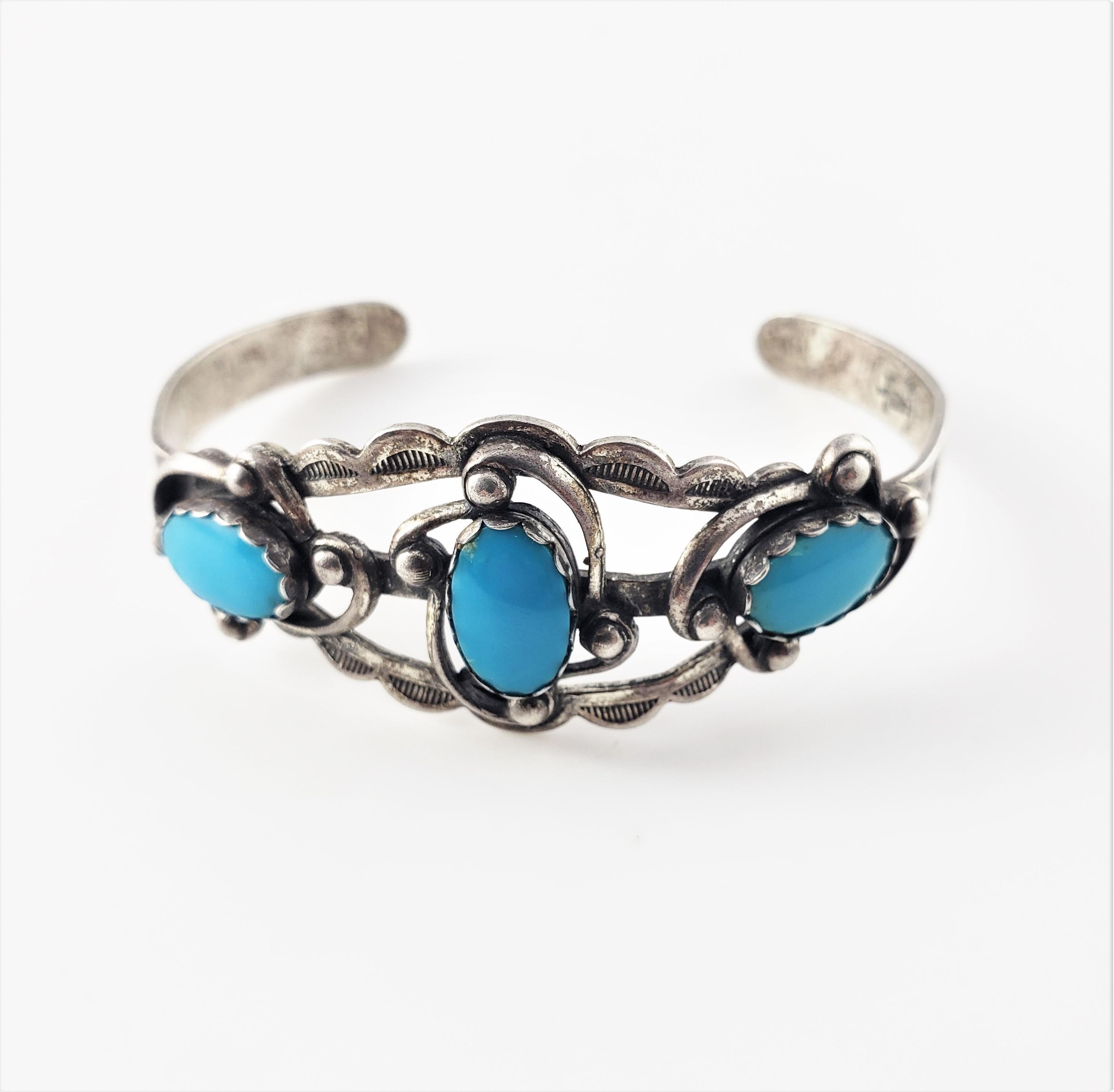 Vintage Native American Sterling Silver Turquoise Cuff Bracelet-

This lovely Native American cuff bracelet features three oval turquoise stones (12 mm x 8 mm x 5 mm each) set in beautifully detailed sterling silver. Width: 0.9