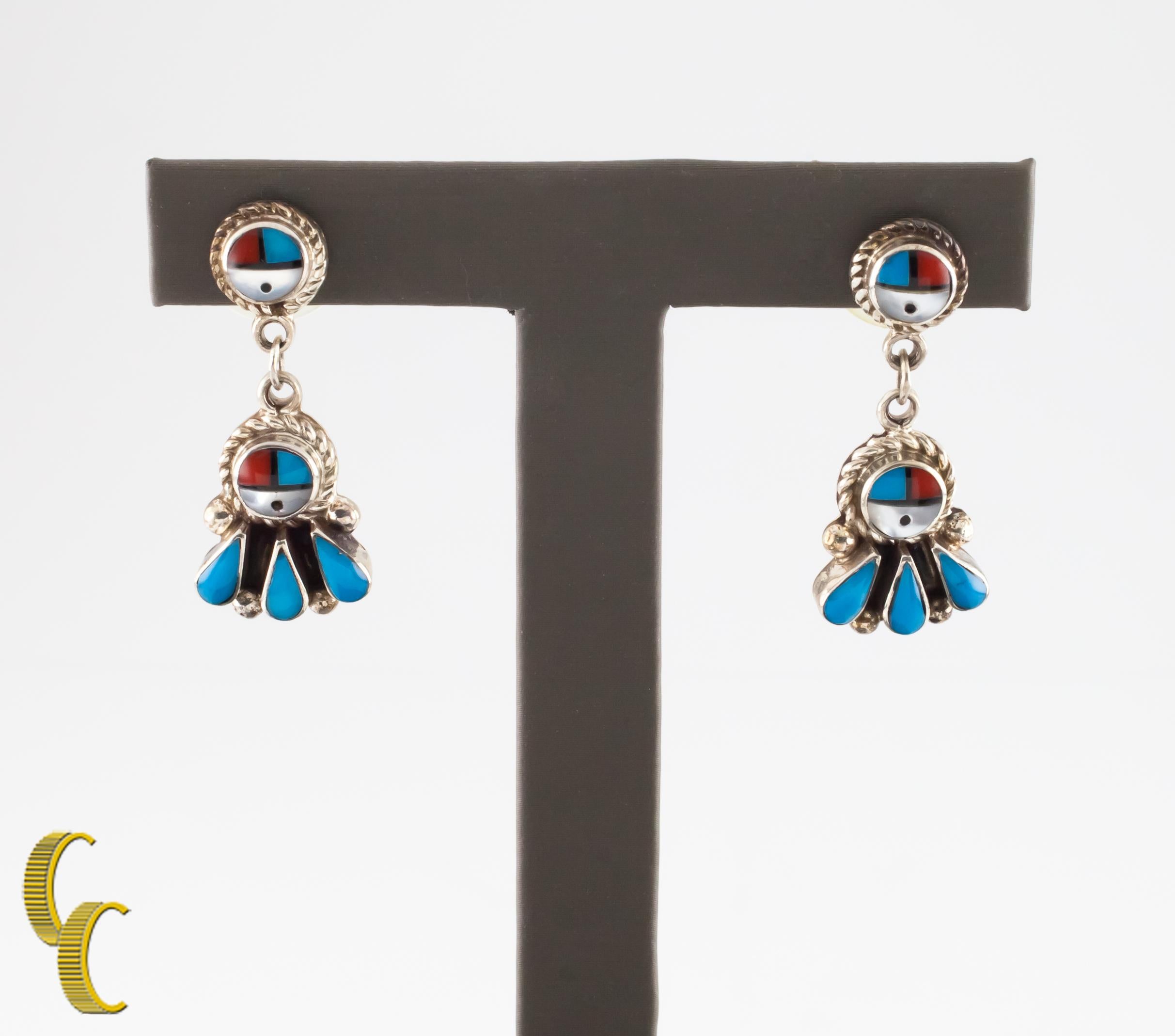 These Native American earrings feature coral and turquoise set in sterling silver.
Length: 34 mm.
Metal: 0.925 sterling silver.
Weight: 9.5 grams.