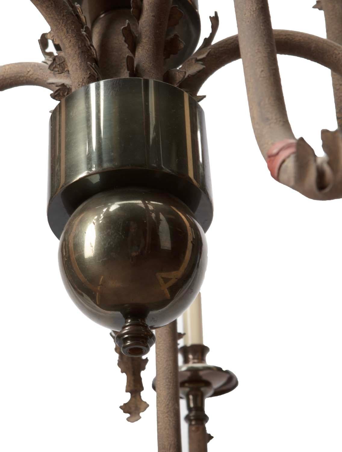 Unique Native American style meets modern, ten light candelabra chandelier with crackled paint, red leather bands and polished steel orbs.