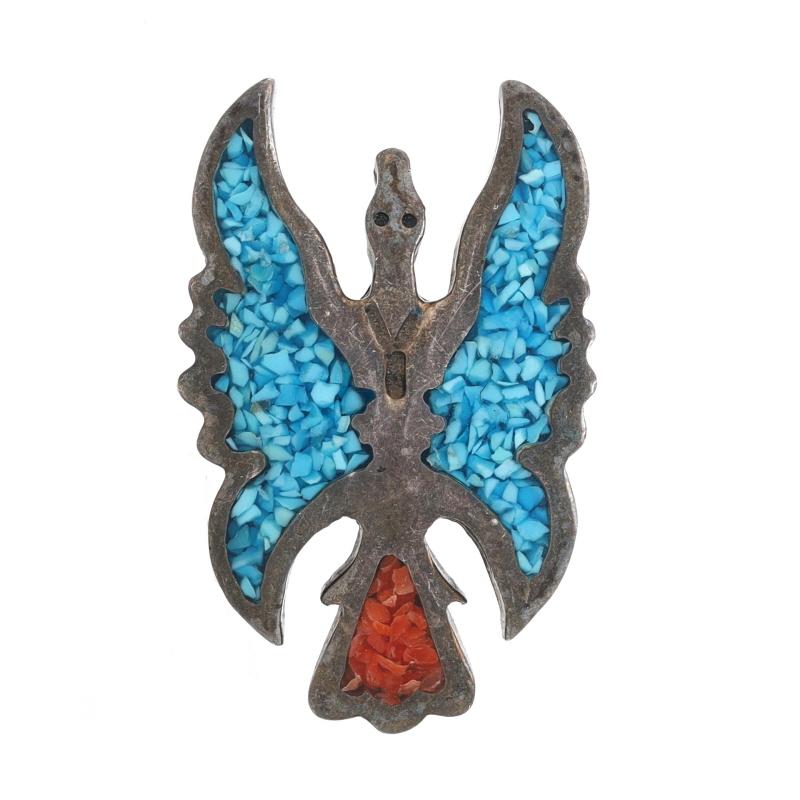 Native American

Metal Content: 925 Sterling Silver

Stone Information
Natural Turquoise
Treatment: Routinely Enhanced
Cut: Mosaic
Color: Blue

Natural Coral
Cut: Masonic
Color: Orangey Red

Theme: Peyote Bird

Measurements
Tall: 1 5/32