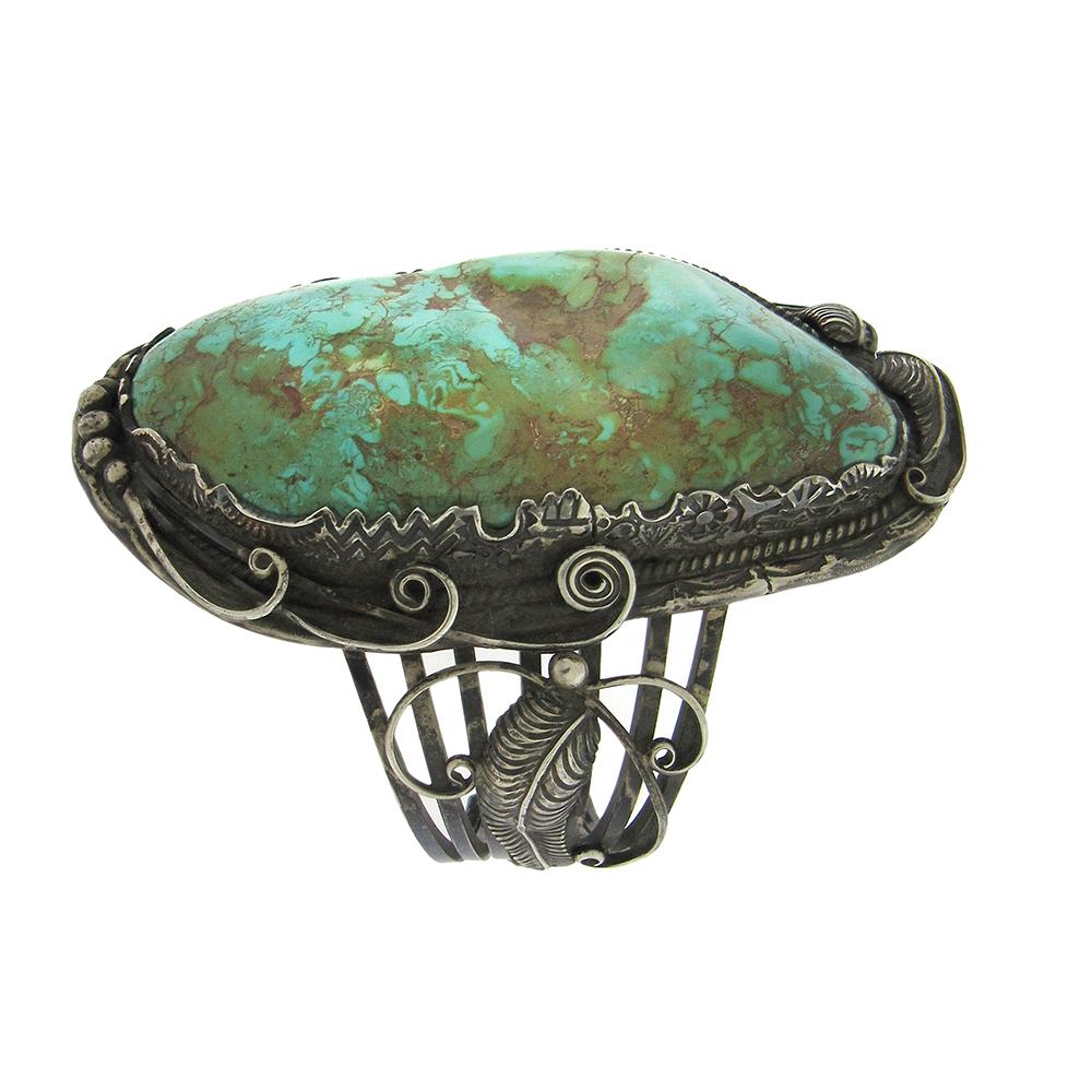 Important early turquoise bracelet by Carl and Irene Clark, hallmarked, is a large approx. 1-1/2