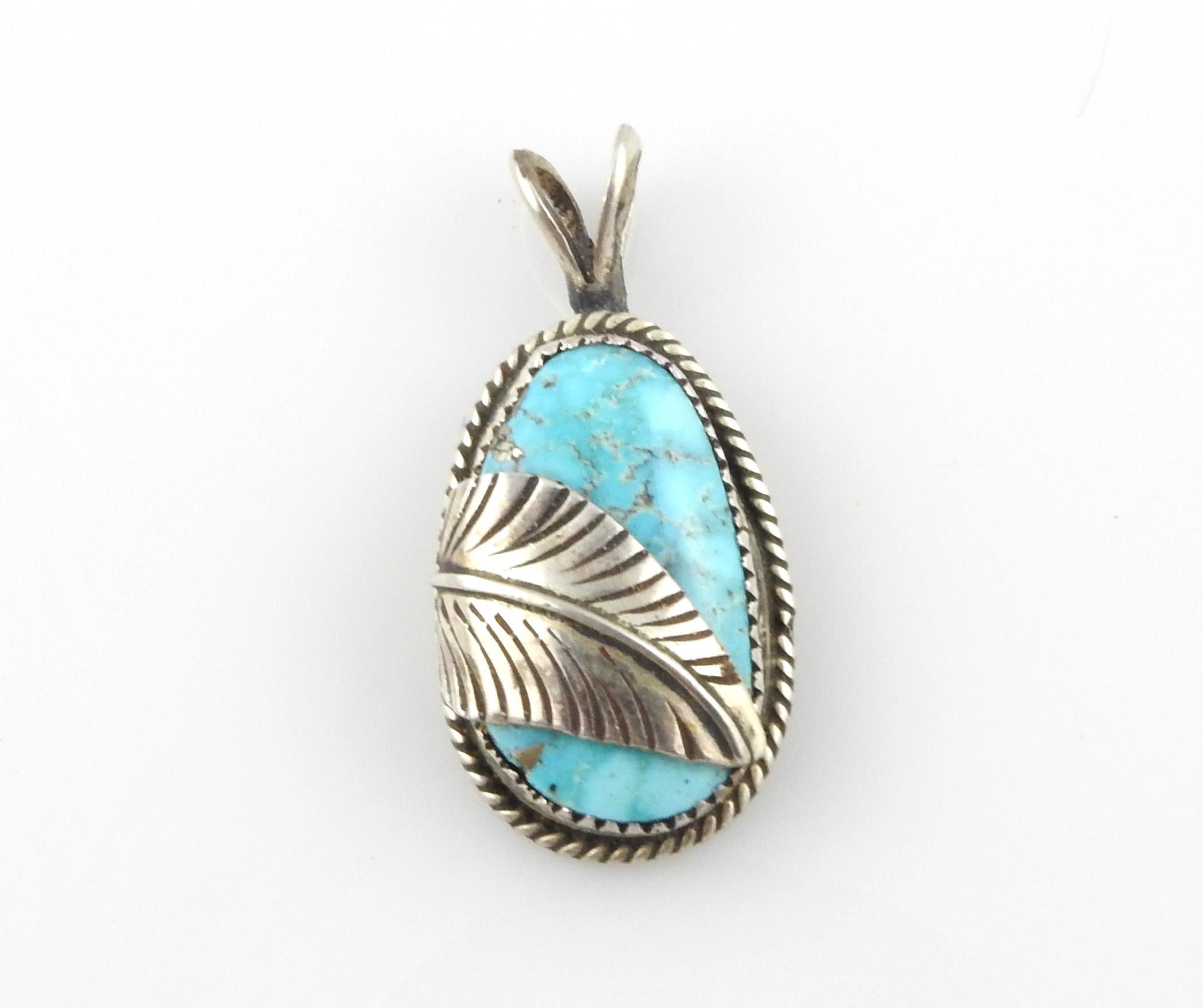 Native American Turquoise Sterling Silver Pendant

Marked: N Sterling A

Measurements:

1 5/8