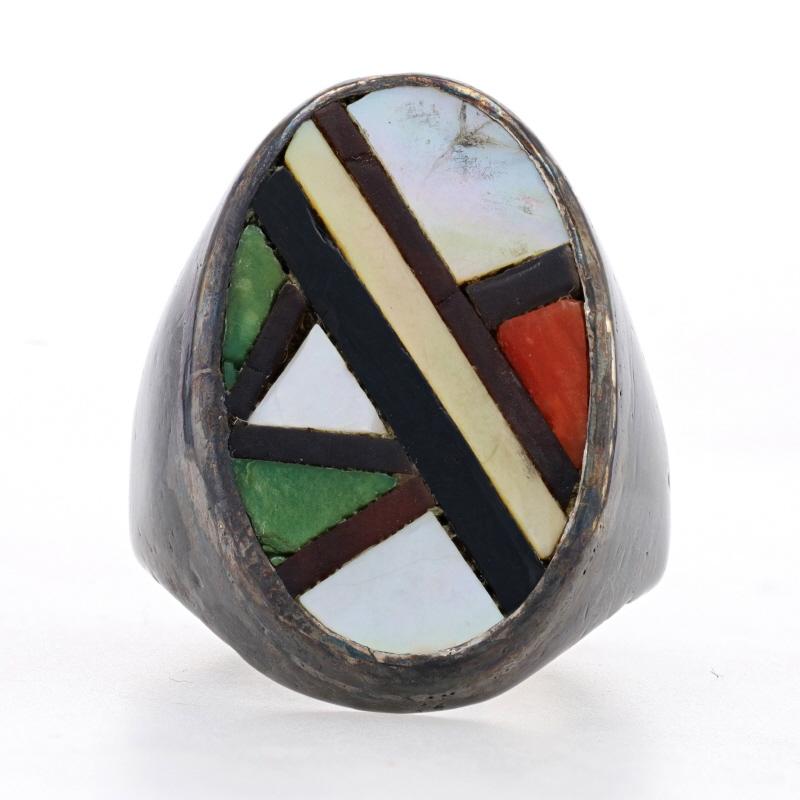 Size: 10 3/4

Native American
Era: Vintage

Metal Content: Sterling Silver

Stone Information
Natural Mother of Pearl
Color: White & Yellow

Natural Green Turquoise
Treatment: Routinely Enhanced

Natural Coral
Color: Orangey Red

Natural Jet
Color: