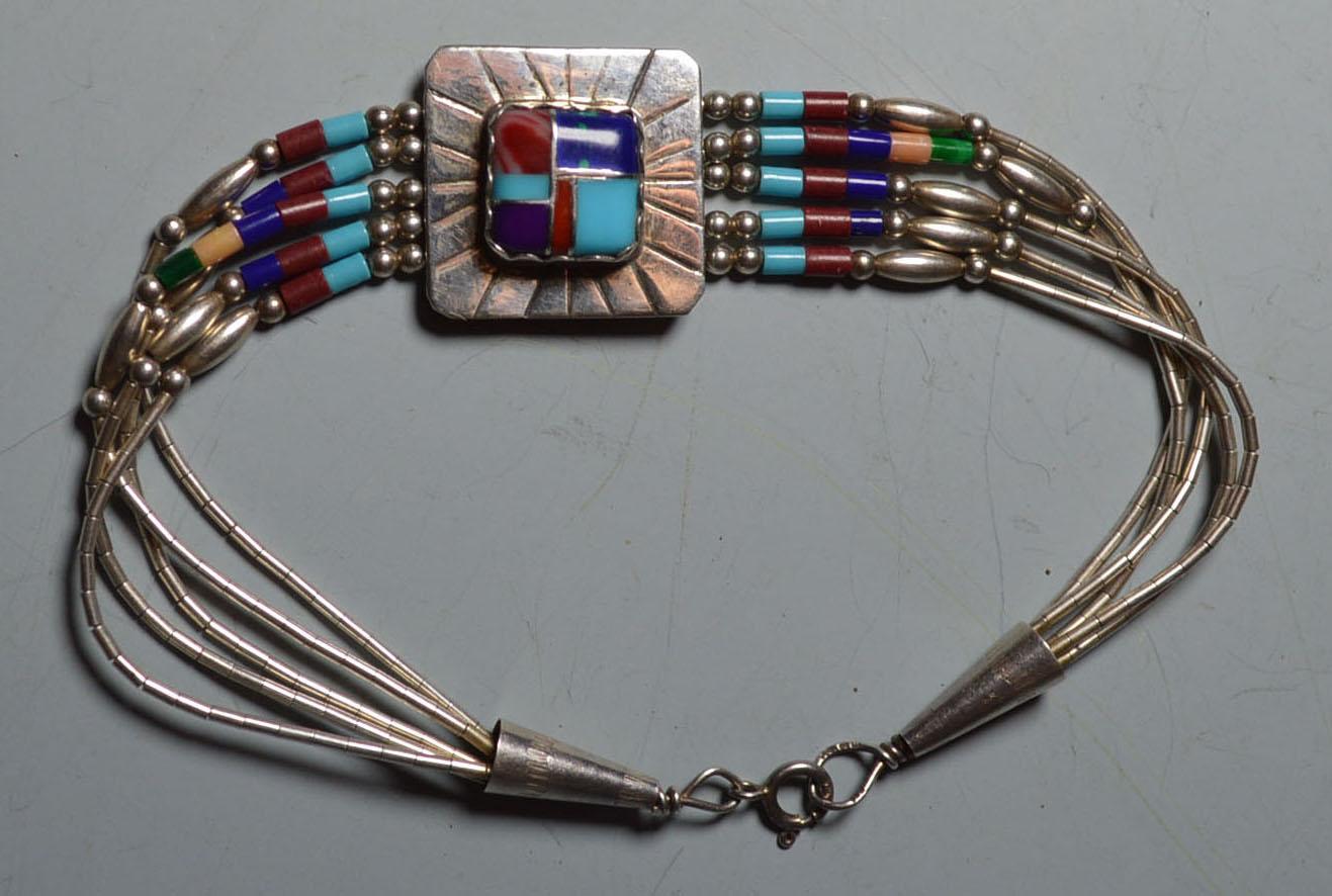 Vintage Zuni silver turquoise bracelet Larry Begaye
Sterling silver with turquoise inlay
Signed Larry Begaye
Period 1960s-1970s
Condition: Fine.



     