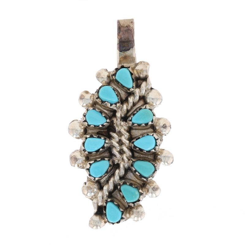 Tribal Affiliation: Zuni

Metal Content: Sterling Silver

Stone Information

Natural Turquoise
Treatment: Routinely Enhanced
Color: Greenish Blue

Theme: Leaf

Measurements

Tall (from stationary bail): 31/32