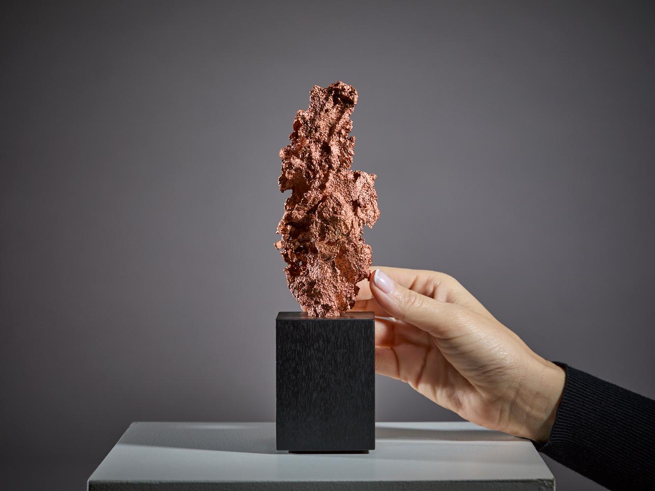 This remarkable specimen is a pure mass of native copper from the
USA, showcasing the metal’s natural crystalline form with exceptional
texture and visual depth. Its intricate surface glistens with metallic luster,
highlighting the raw beauty and