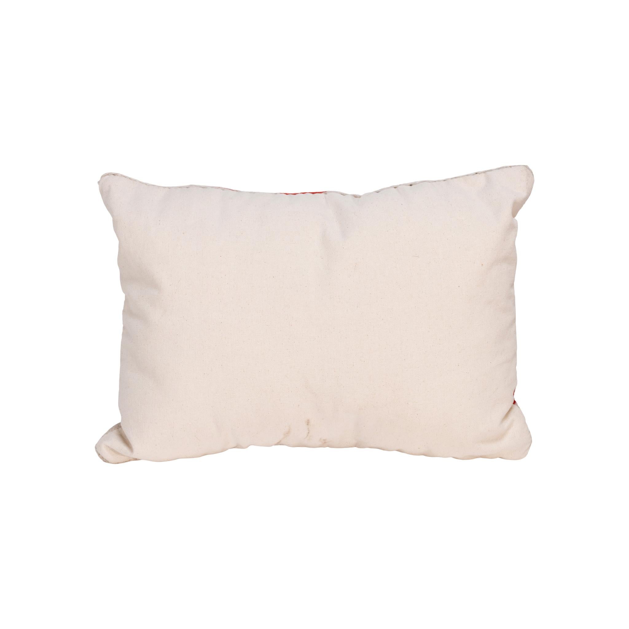 Native transitional pillow. Handmade pillow with front made of Navajo 1880's transitional weaving. Backed with canvas. Featuring natural dyed colors of cream, red, brown, and green. 18