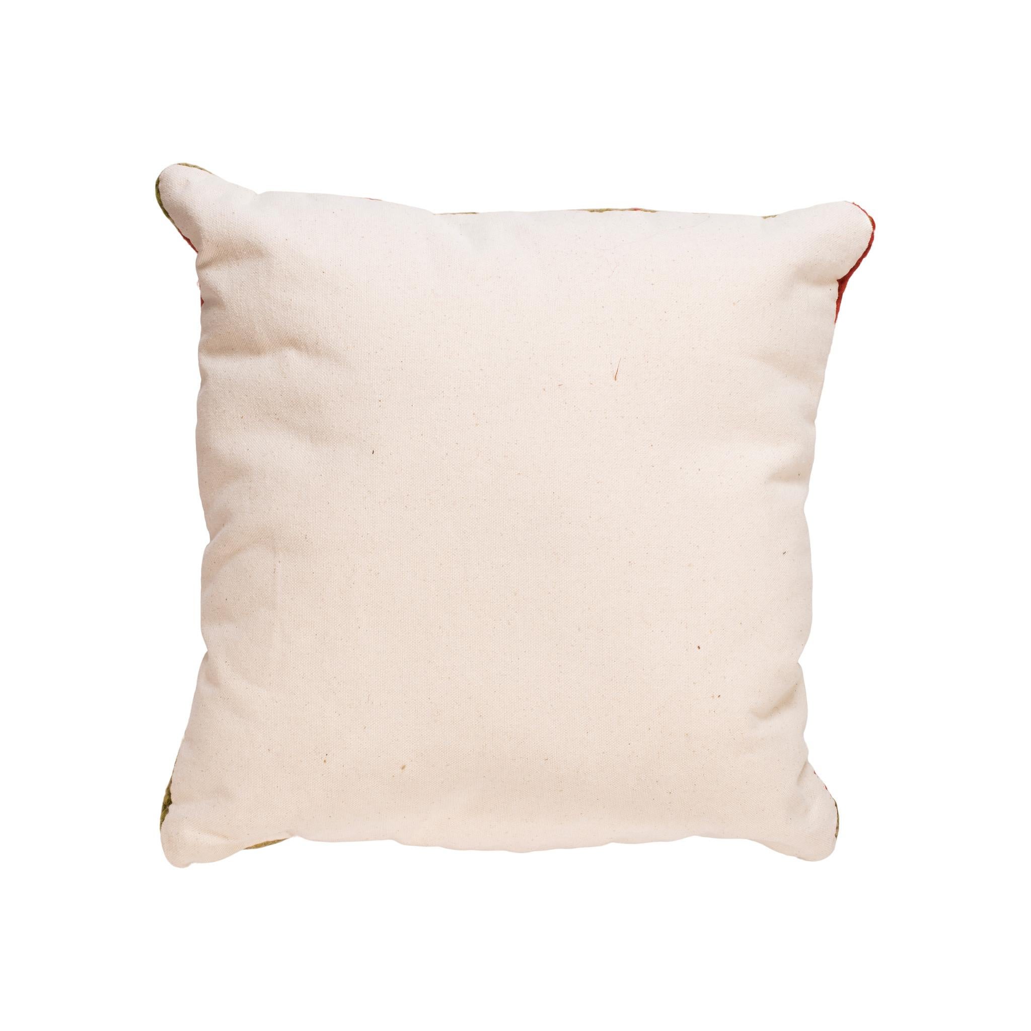 Native transitional lodge pillow. Handmade pillow with front made of Navajo 1880's transitional weaving with black leather strip down center. Backed with canvas. Featuring natural dyed colors of cream, red, brown, and green. 14 1/2