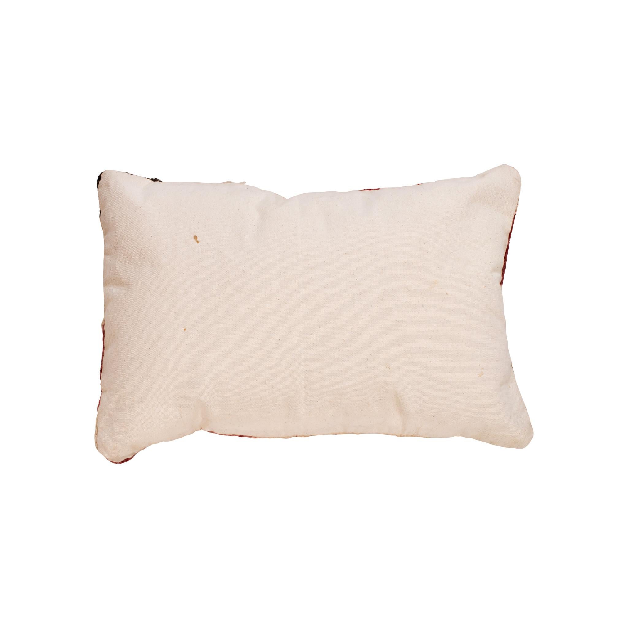 Native transitional lodge pillow. Handmade pillow with front made of Navajo 1880's transitional weaving. Backed with canvas. Featuring natural dyed colors of cream, red, and brown. 16
