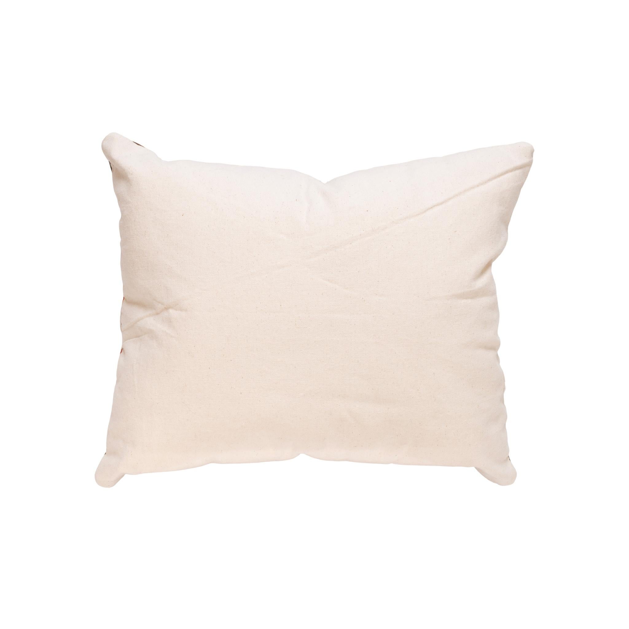 Native transitional lodge pillow. Handmade pillow with front made of Navajo 1880's transitional weaving, edged with brown leather. Backed with canvas. Featuring natural dyed colors of cream, red, brown, and green.

Family Owned & Operated
Cisco’s