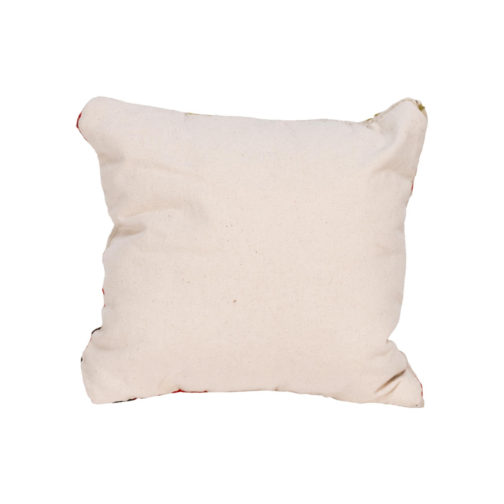 Native transitional Lodge pillow. Handmade pillow with front made of half Navajo 1880's transitional weaving and half made of dark leather. Backed with canvas. Featuring natural dyed colors of cream, red, and green.

Family Owned & Operated
Cisco’s