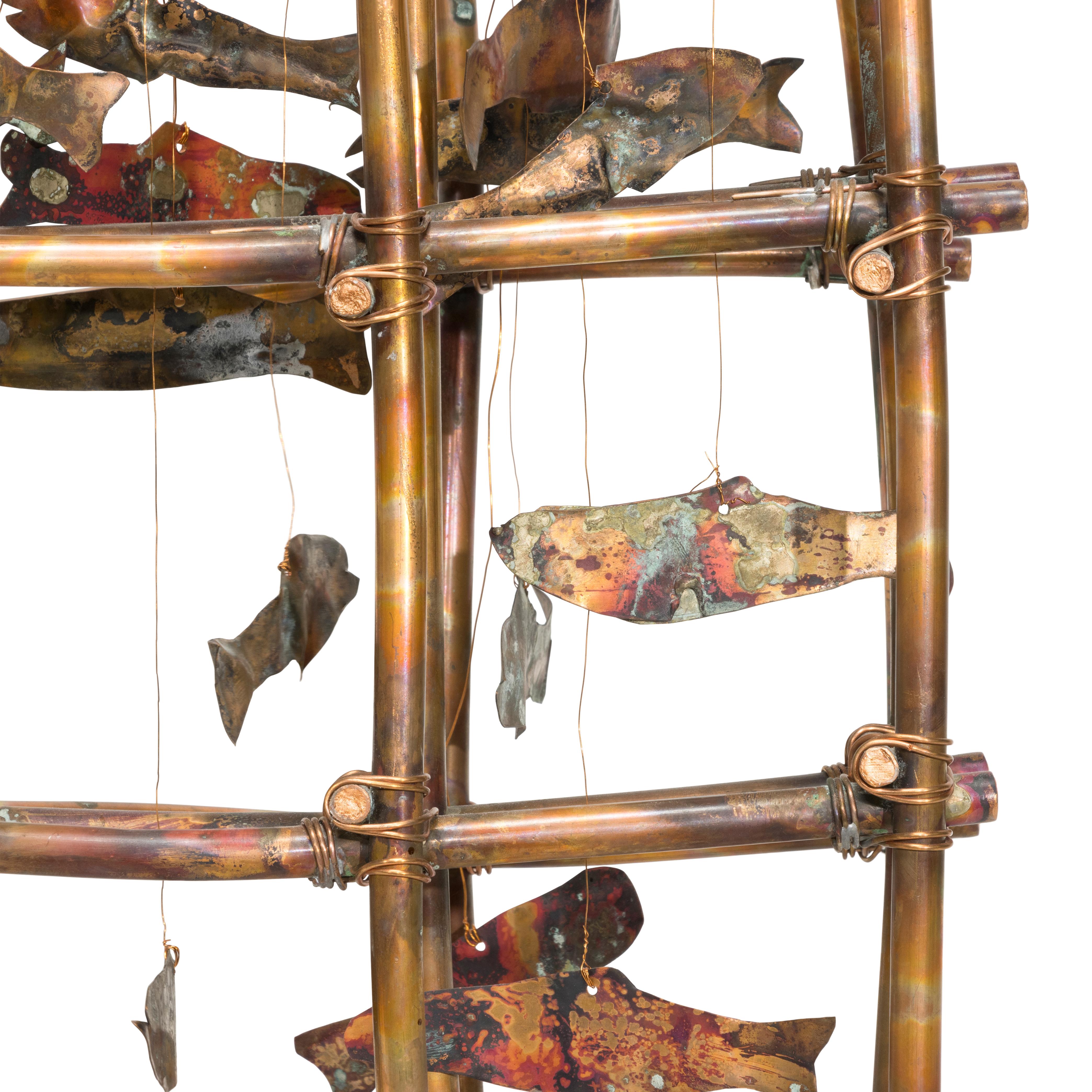 Salmon ladder/rattle maquette by Lillian Pitt (1943 Wasco). Made of copper tubing and hanging cut copper salmon. Maquette for public commission at the University of Washington that was never produced. 18