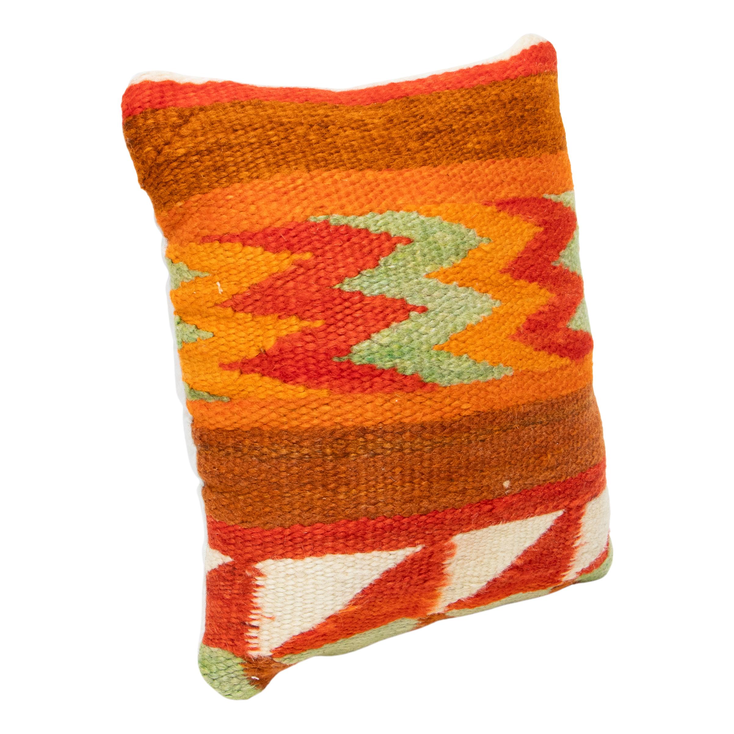 Native  transitional pillow. Handmade pillow with front made of Navajo 1880's transitional weaving. Backed with canvas. Featuring natural dyed colors of cream, red, brown, green, and orange. 14