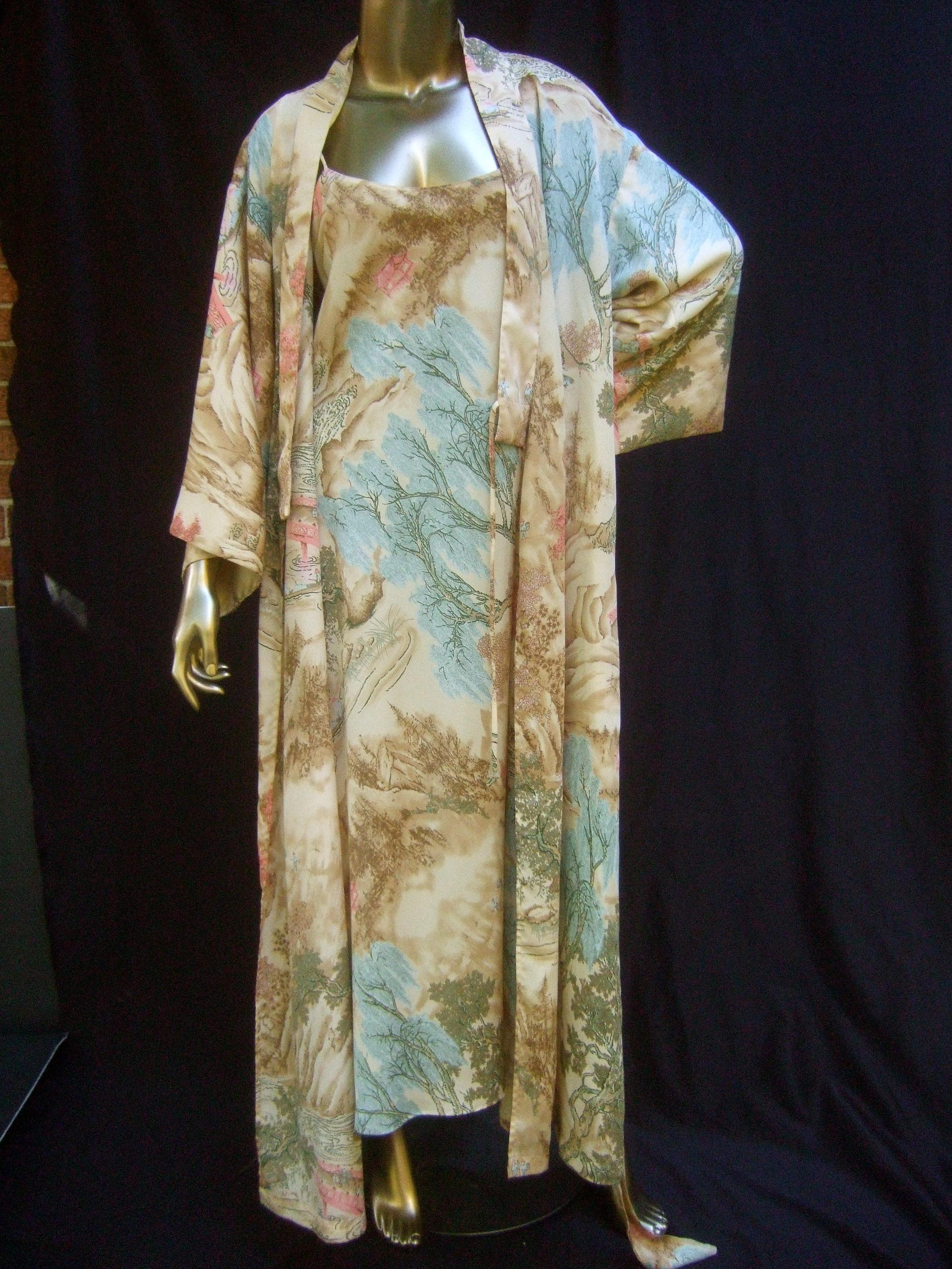 Natori Asian print peignoir duster robe & slip gown ensemble Size M
The luxurious silky duster robe & matching slip gown lingerie 
are illustrated with a Japanese outdoor scene with lush foliage

Set within the outdoor scene are sporadic figures
