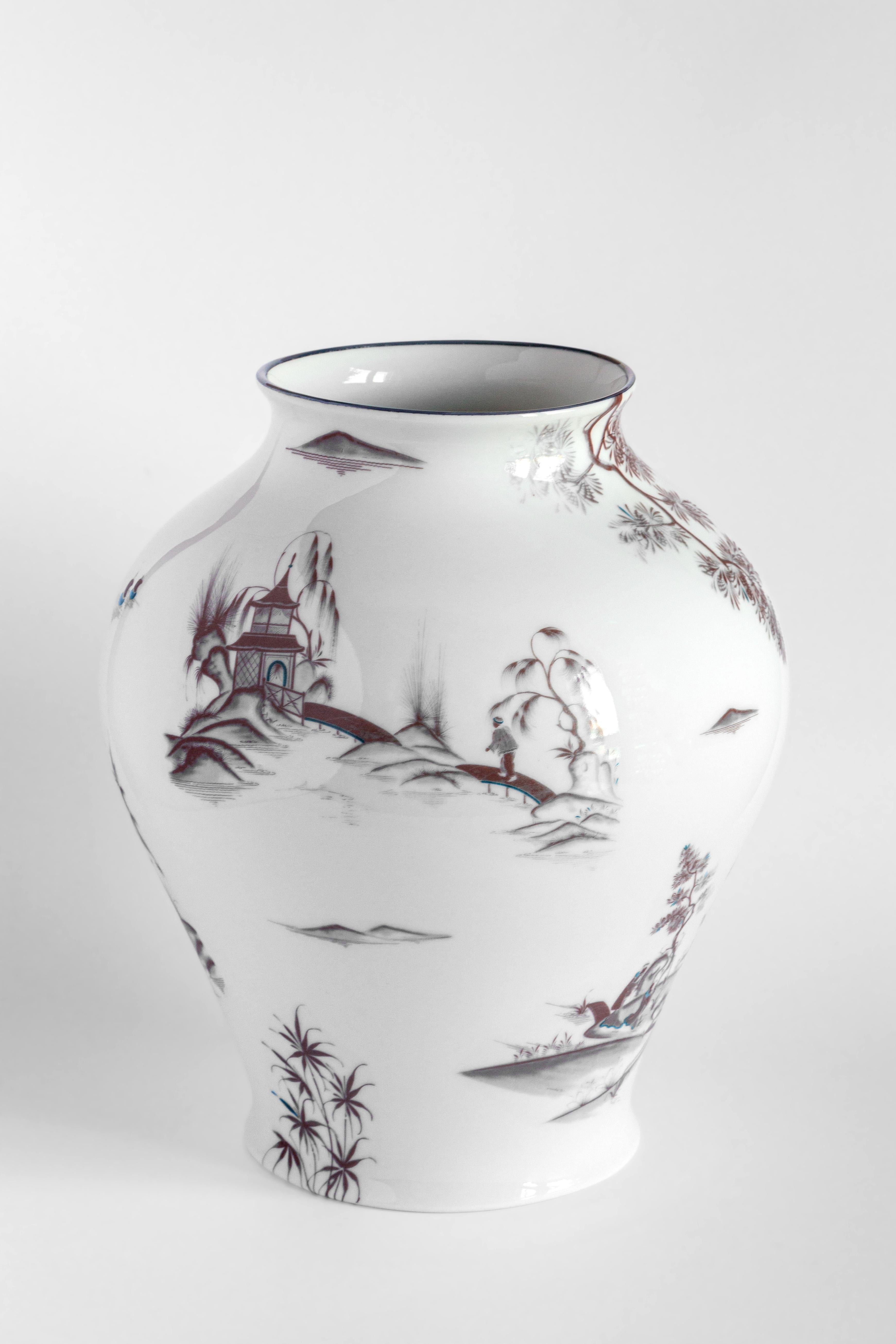 The Classic design of this porcelain vase comes back to life with retro decorations with a contemporary flavor. Natsumi vase evoke dream-like images of Japanese landscapes. Rendered in the Imari tradition, the vase's color palette of reddish-orange