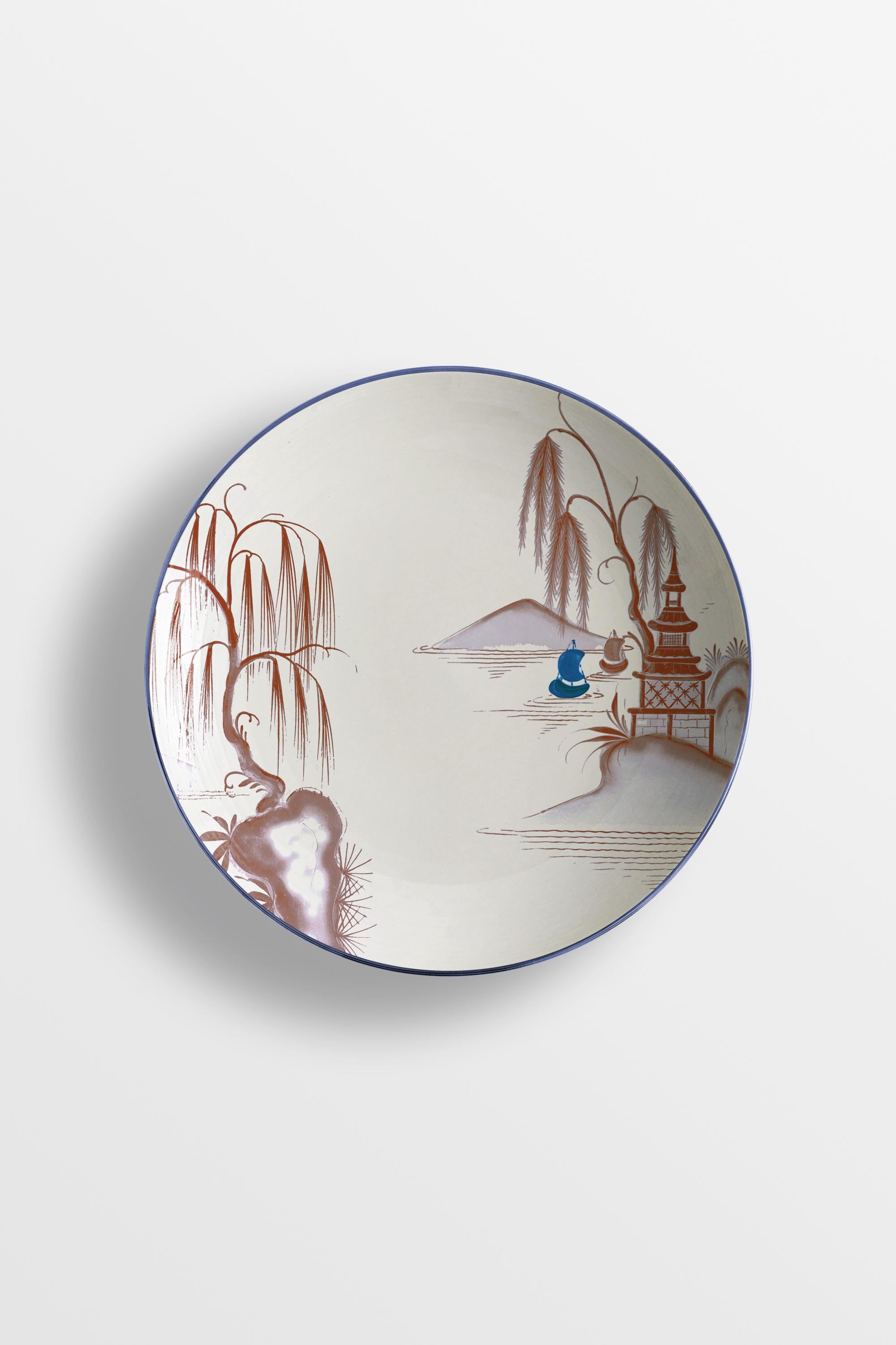 Bordeaux and blue are the primary colors of this Japan inspired collection of plates, where ancient Japanese scenes take place on the rivers of a fairy lake.
6 Soup plates.