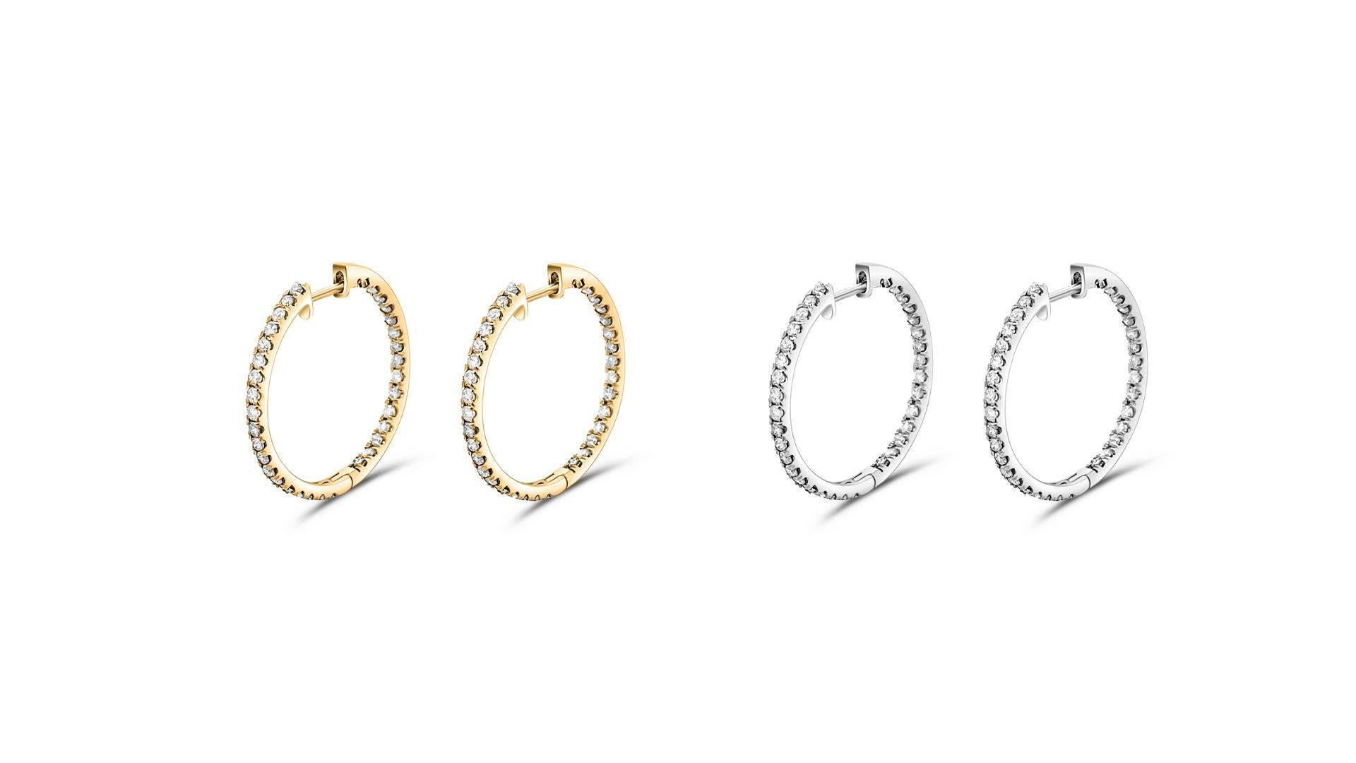 Natural diamond 1.20 CTTW pave classic inside-out eternity hoop earrings in 14k solid gold. Available in 14k white or yellow gold. 

These earrings have a secure latch closure that stays firm on the earlobe during wear, getting just the right amount