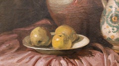 Still life with tablecloth, two pitchers and a plate with apples