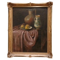 Still life with tablecloth, two pitchers and a plate with apples