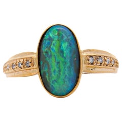 Bague en or jaune 18 carats et 14 carats, diamant naturel de 0,12 carat et doublet d'opale noire