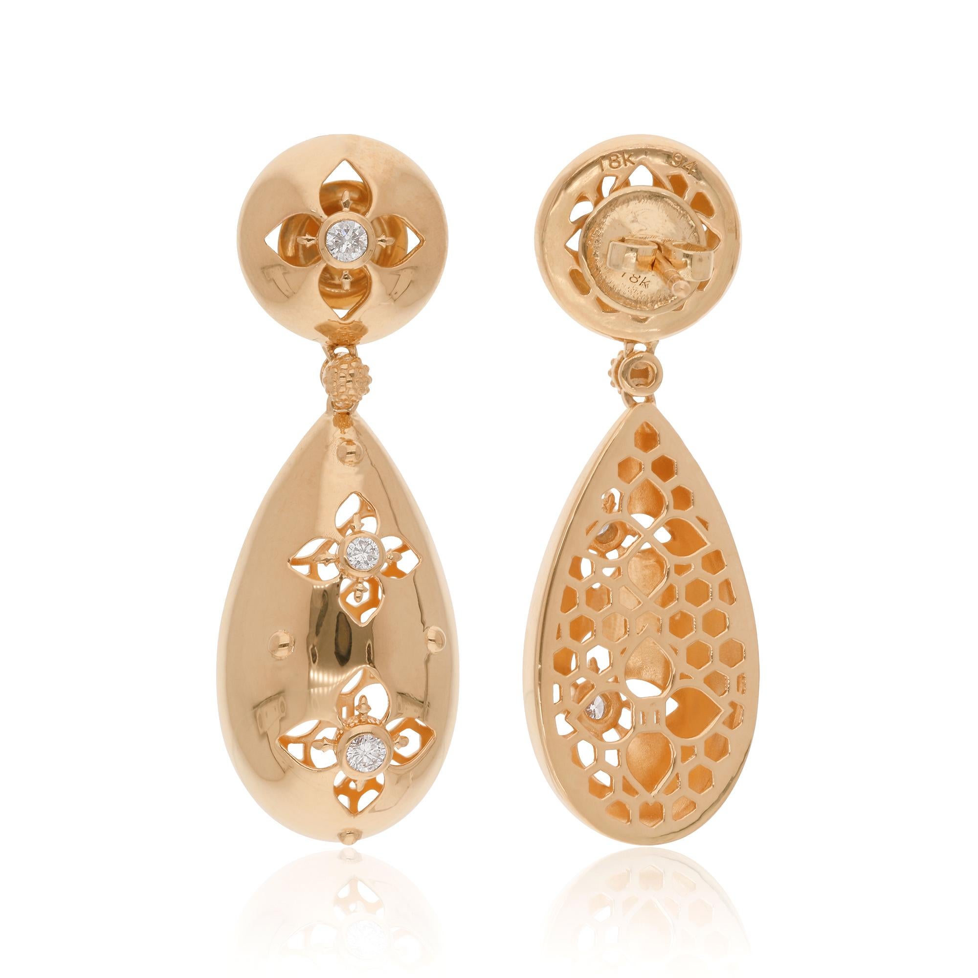 Immerse yourself in the delicate beauty of nature with these enchanting Natural 0.28 Carat Diamond Flower Dangle Earrings, intricately crafted in lustrous 18 Karat Yellow Gold. These exquisite earrings are a celebration of elegance and femininity,