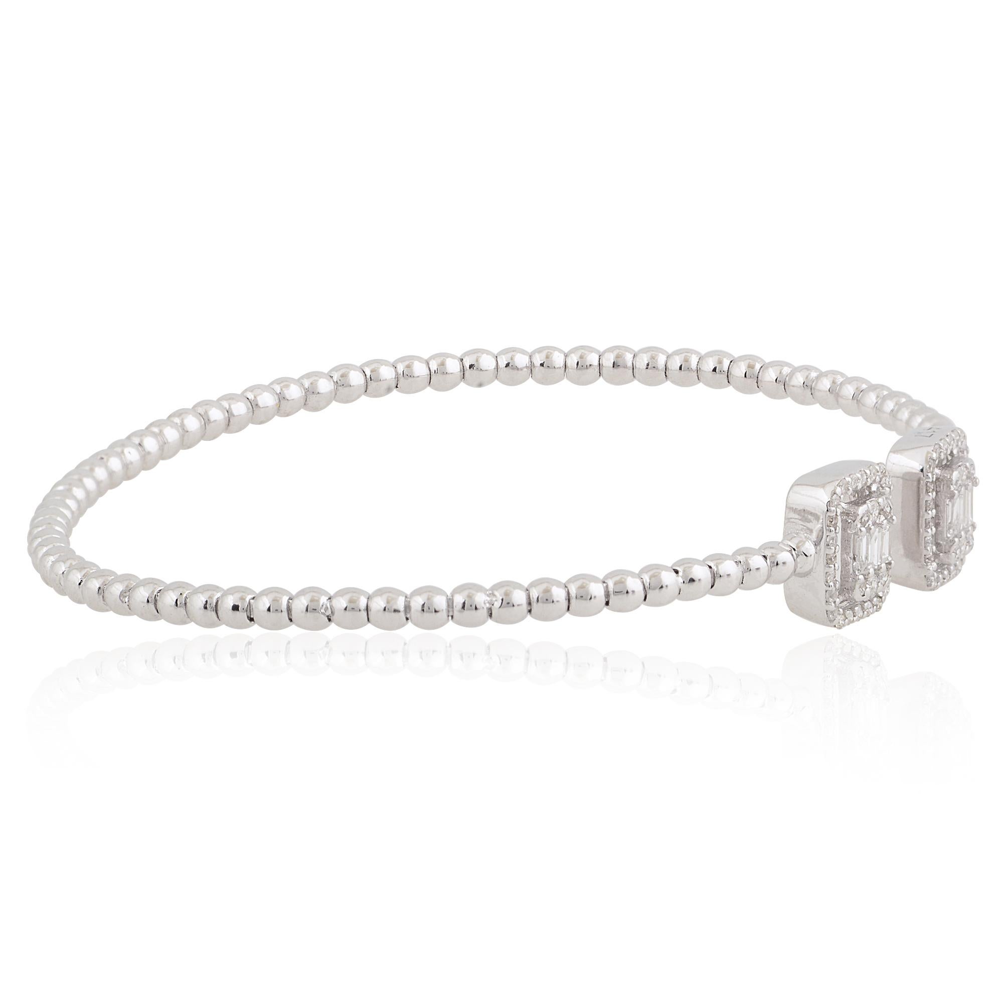 Step into the world of understated elegance with this exquisite Natural 0.40 Carat Baguette Diamond Cuff Bangle Bracelet, meticulously crafted in luminous 10 Karat White Gold. This bracelet is a true testament to refined sophistication, offering a