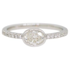 Natural 0.48 Carat Oval Shape Diamond Bezel Set 18-Karat Fashion Ring In Stock