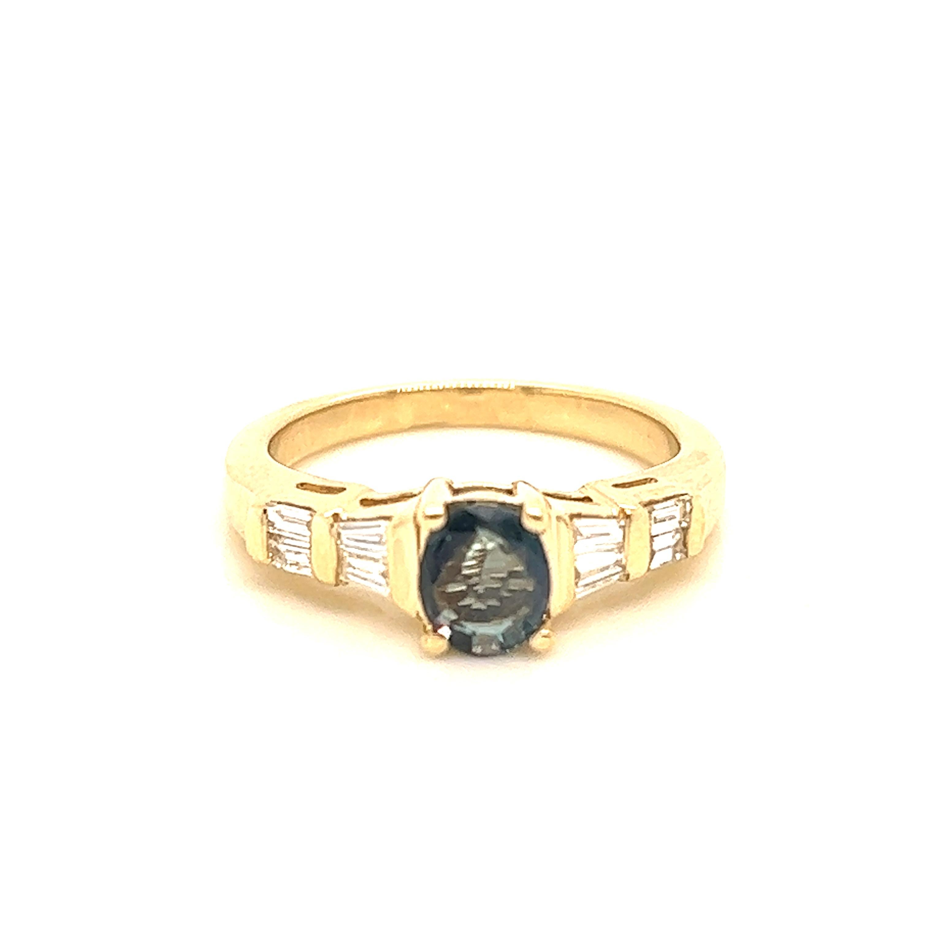 This is a gorgeous natural AAA quality oval Alexandrite surrounded by dainty diamonds that is set in a vintage yellow gold setting. This ring features a natural 0.78 carat oval alexandrite that is surrounded by brilliant white diamonds. The ring is