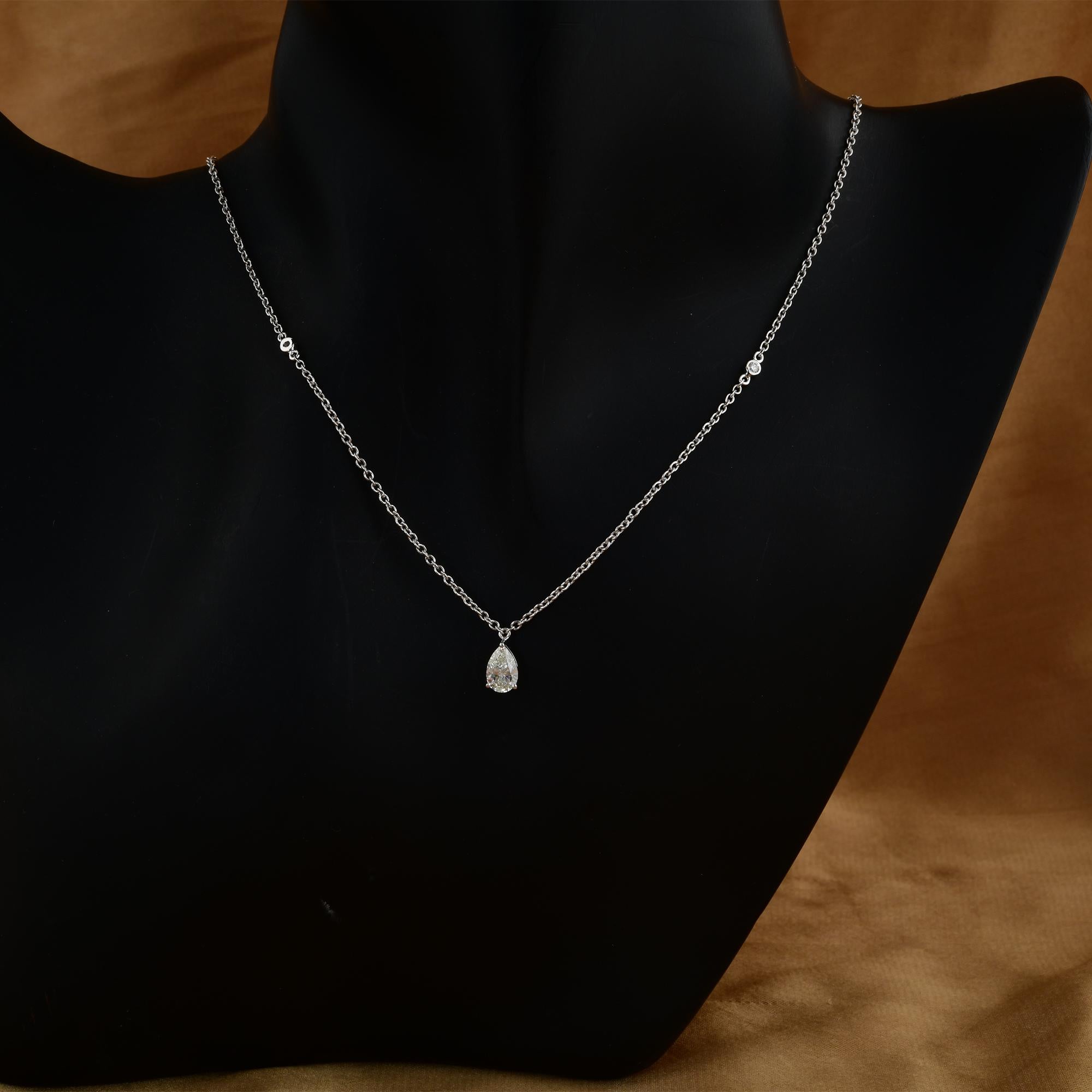 The centerpiece of this necklace is a beautiful pear-shaped diamond, radiating brilliance and allure. Surrounding the pear diamond are delicately arranged round diamonds, each meticulously set to enhance the overall sparkle and beauty of the