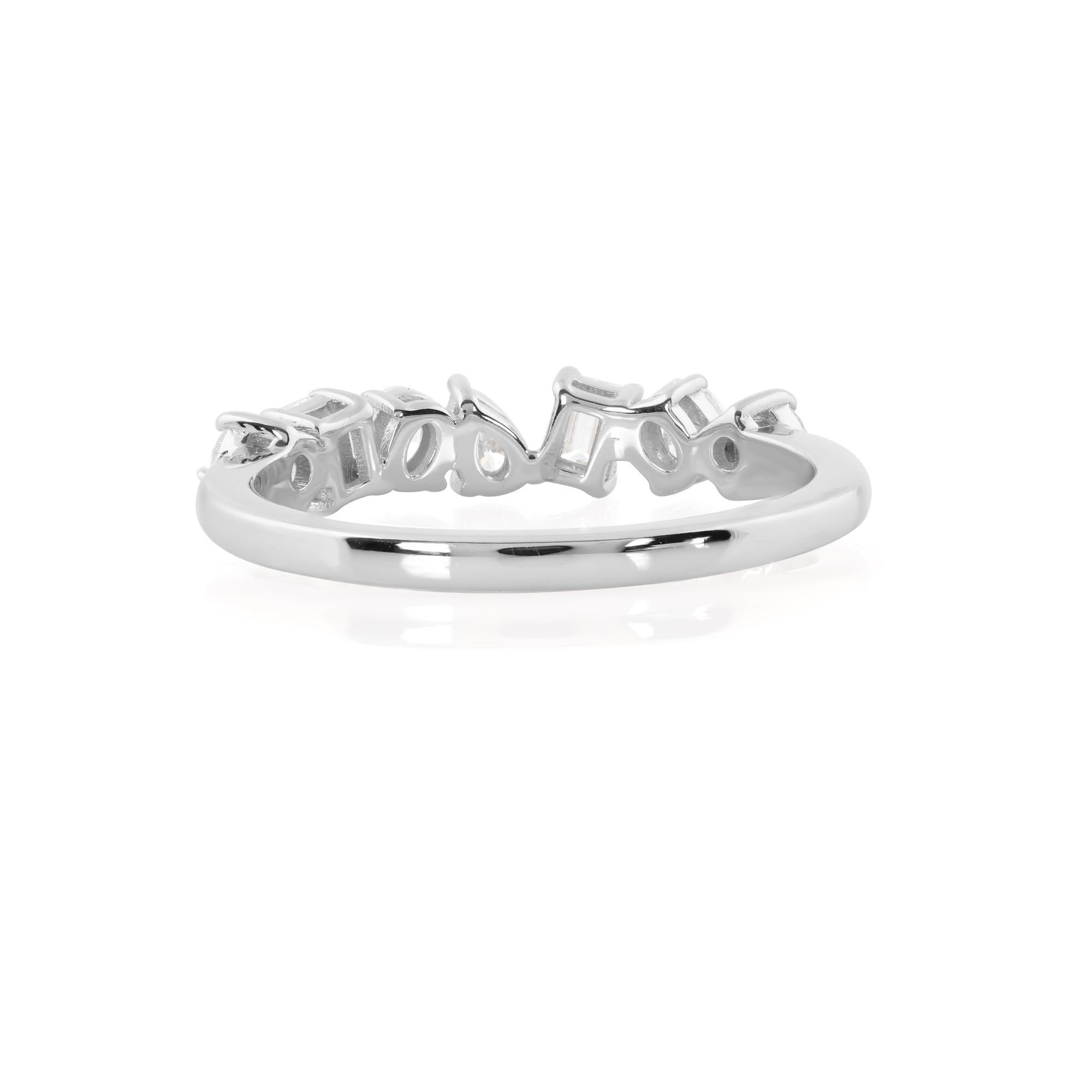 Set in a sumptuous 14 karat white gold band, the diamonds are arranged in a harmonious composition, carefully handcrafted to enhance their splendor and create a captivating play of light. Every detail of the band, from its smooth curves to its
