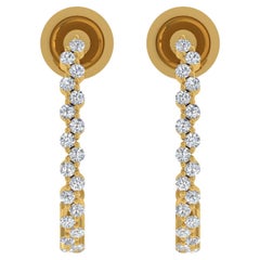 Boucles d
oreilles en or jaune 18 carats diamant naturel 0.6 carat SI/H taille ronde et brillante