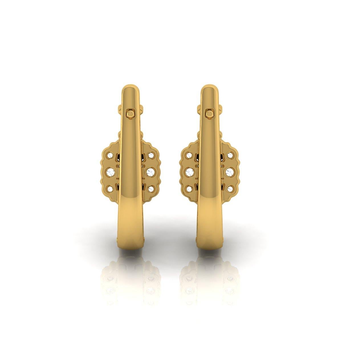 Coulées dans de l'or 14 carats, ces boucles d'oreilles exquises sont serties de 0,65 carats de diamants étincelants.

Suivez la vitrine de Spectrum Jewels pour découvrir la dernière collection et les pièces exclusives. Spectrum Jewels est fièrement