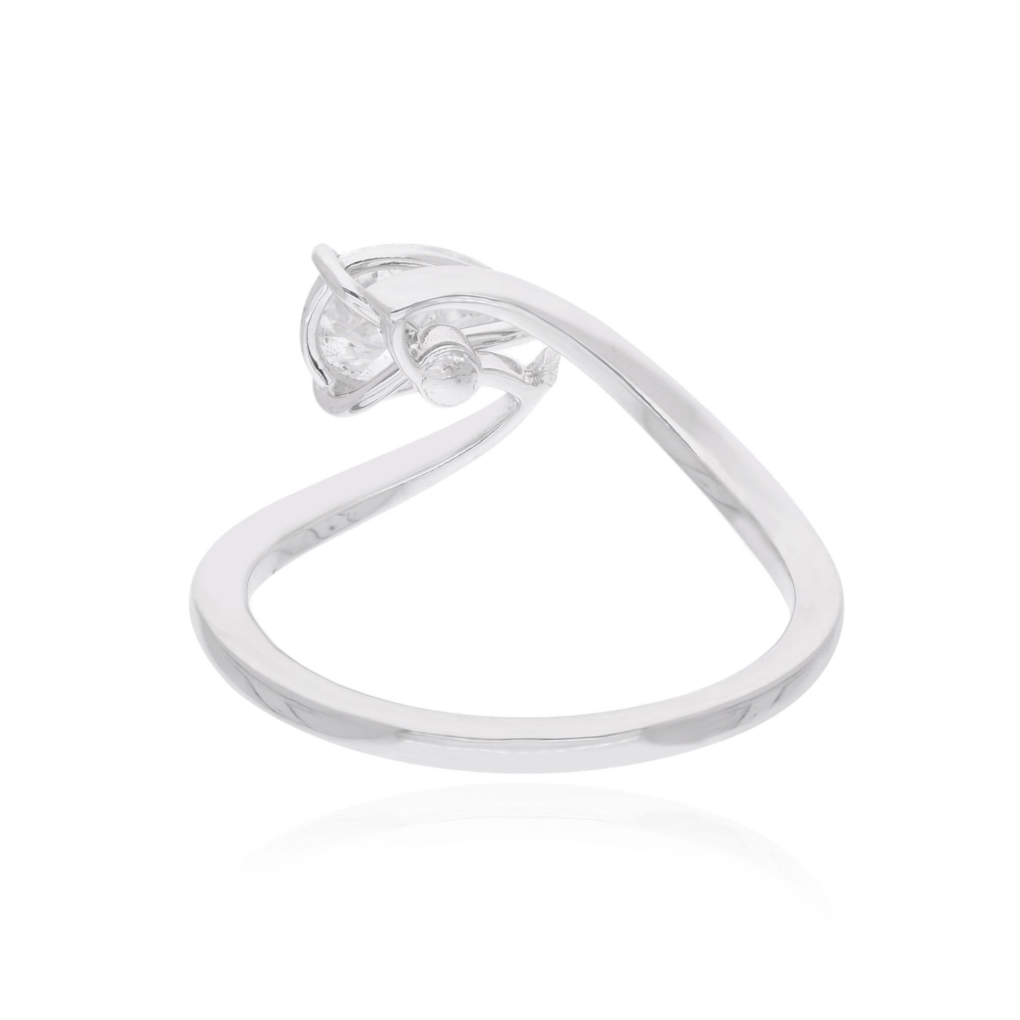 Embrace the timeless allure of this Natural 0.75 Carat Solitaire Pear Shape Diamond Ring, meticulously crafted in 14 karat white gold to capture the essence of elegance and sophistication. At the heart of this exquisite ring lies a stunning