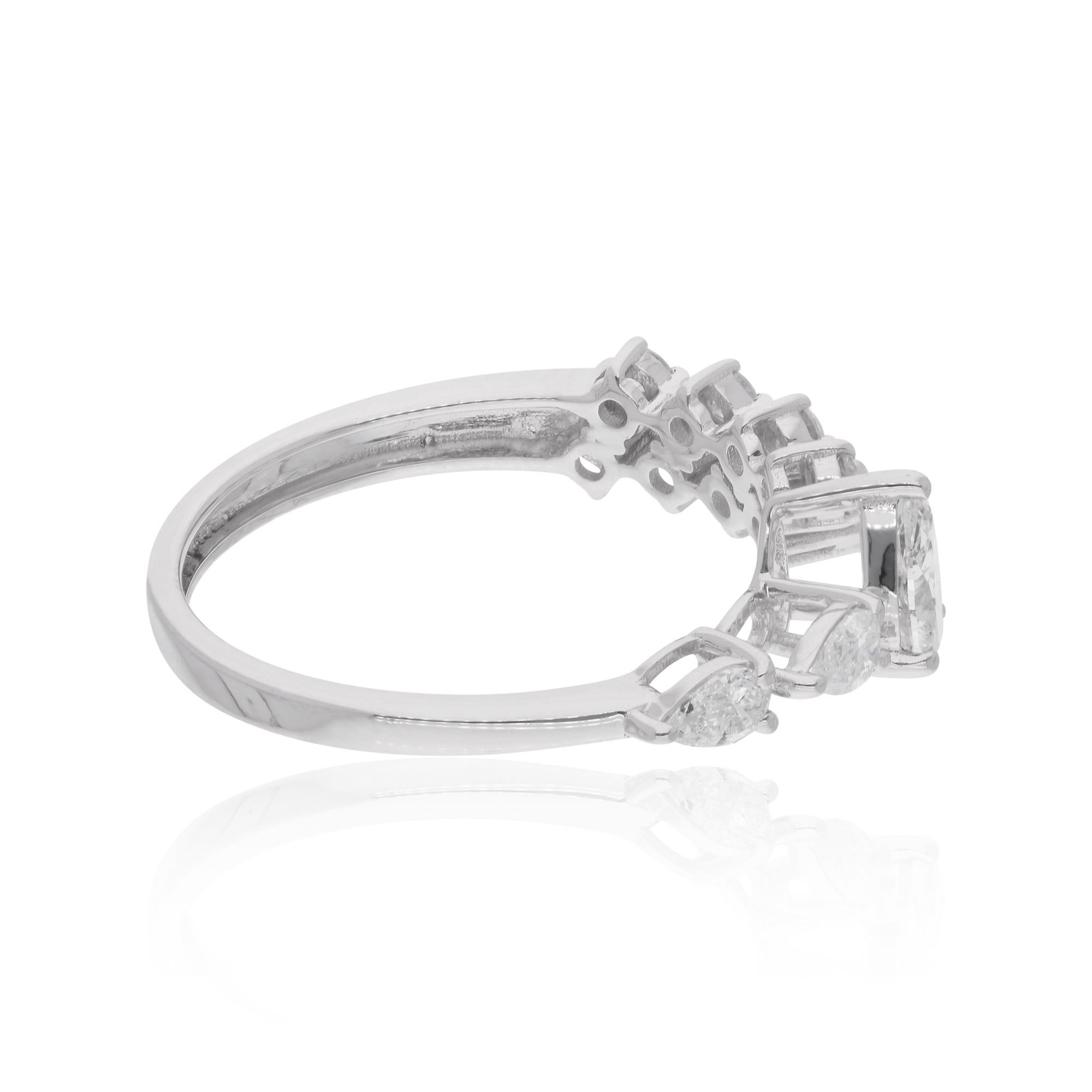 The 14 karat white gold setting enhances the brilliance of the diamonds, providing a radiant backdrop that accentuates their natural beauty. The cuff design adds a contemporary twist to the traditional ring silhouette, offering a comfortable and