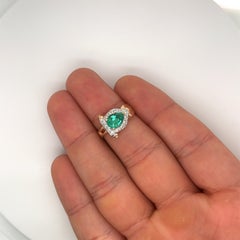 Natural 0.86 Pear Cut Natural Emerald with Diamond Side Stones in 14K Gold Ring