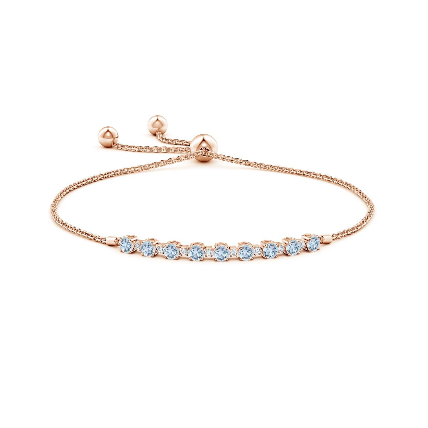 Sea blue aquamarines and glittering diamonds come together on this 14k rose gold tennis bolo bracelet. They are prong set alternately and create a classic look. This bracelet is adjustable to fit most wrists.