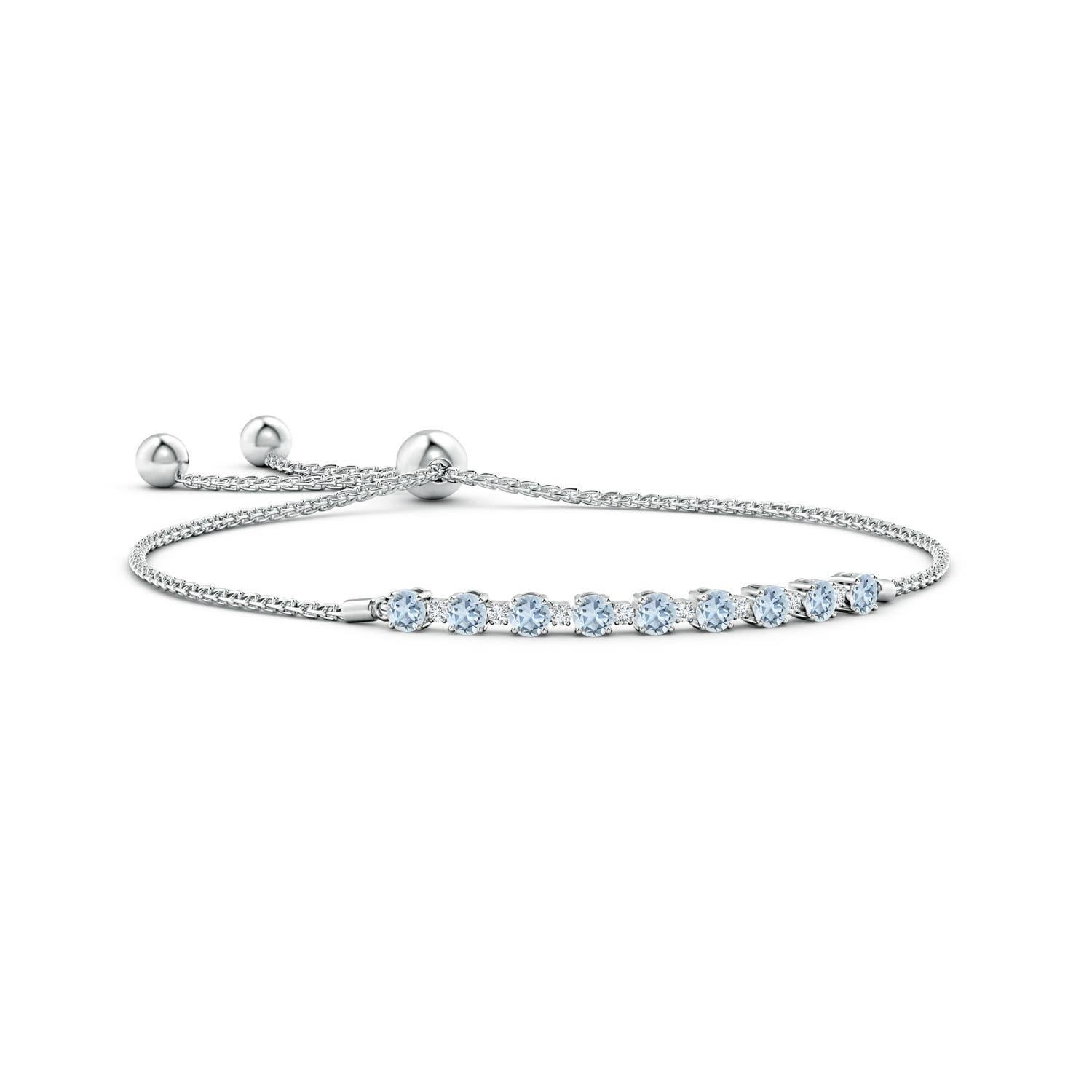 Sea blue aquamarines and glittering diamonds come together on this 14k white gold tennis bolo bracelet. They are prong set alternately and create a classic look. This bracelet is adjustable to fit most wrists.