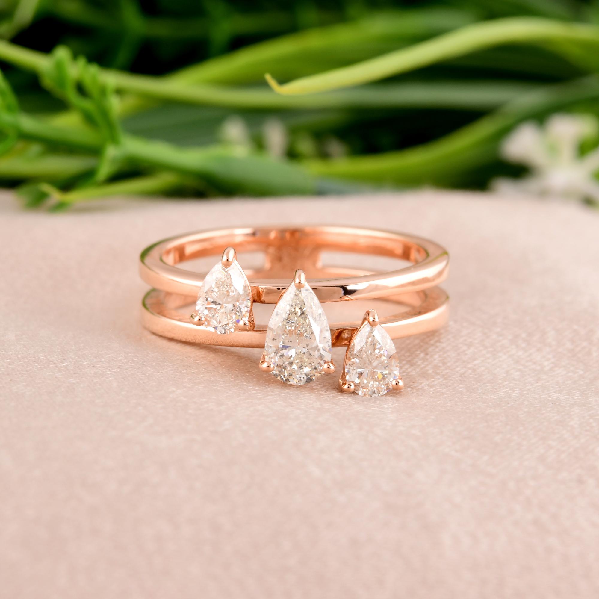 Introducing a captivating piece of fine jewelry: the natural 0.95 carat pear-shaped diamond band ring, elegantly crafted in luxurious 14 karat rose gold. This exquisite ring is more than just an accessory; it's a symbol of grace, sophistication, and