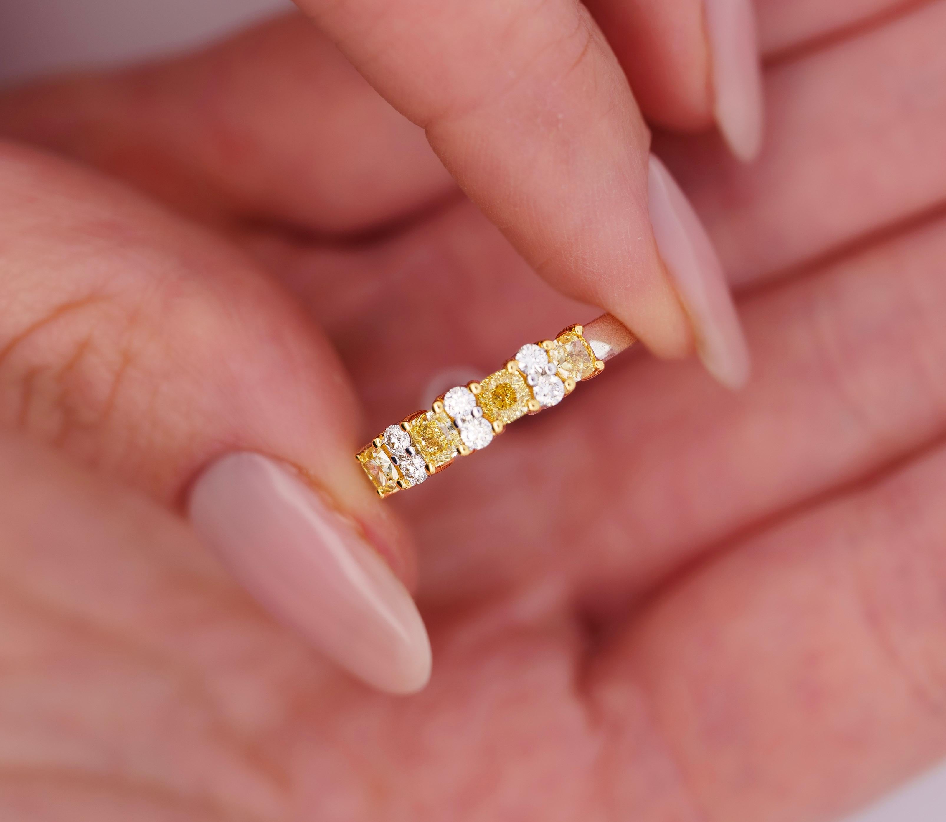 1 Carat Total Fancy Yellow and White Diamond Band Ring in 18k Solid Gold. This stackable band features superbly brilliant natural diamonds that flank each other with excellent contrast and symmetry. The perfect band ring that matches both yellow and