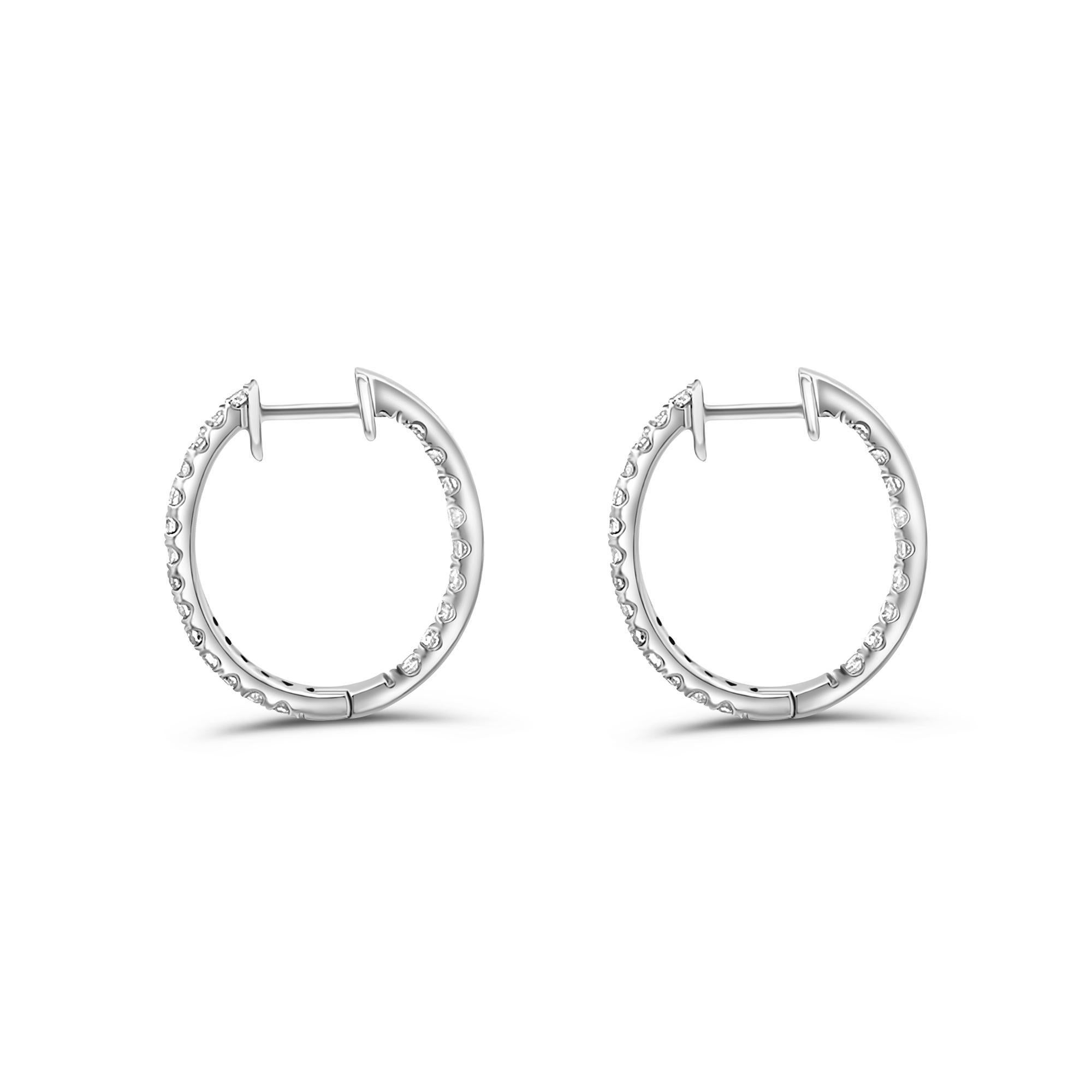Simple and elegant natural diamond classic hoop earrings set in 14k Solid Gold for long-lasting and durable use. Hinged snap-back closure with a strong lever for extra versatility and comfort. Inside out eternity setting for sparkling brilliance at