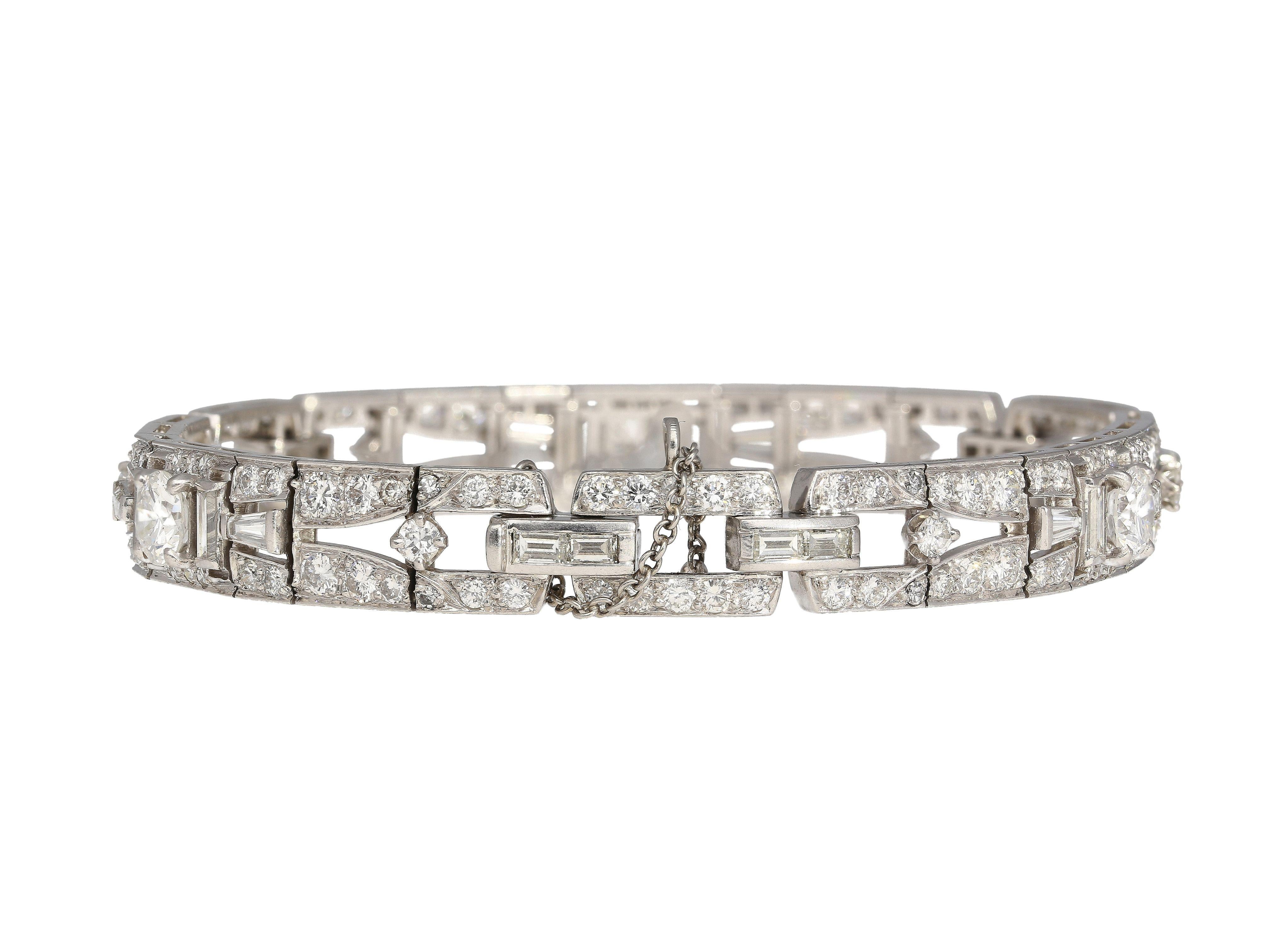 Exquisite 10-Carat Total Natural Diamond Vintage Bracelet.

Step into a world of timeless beauty with our vintage bracelet, a relic from the 1930s. This captivating piece showcases a stunning array of round and baguette cut diamonds, totaling 10