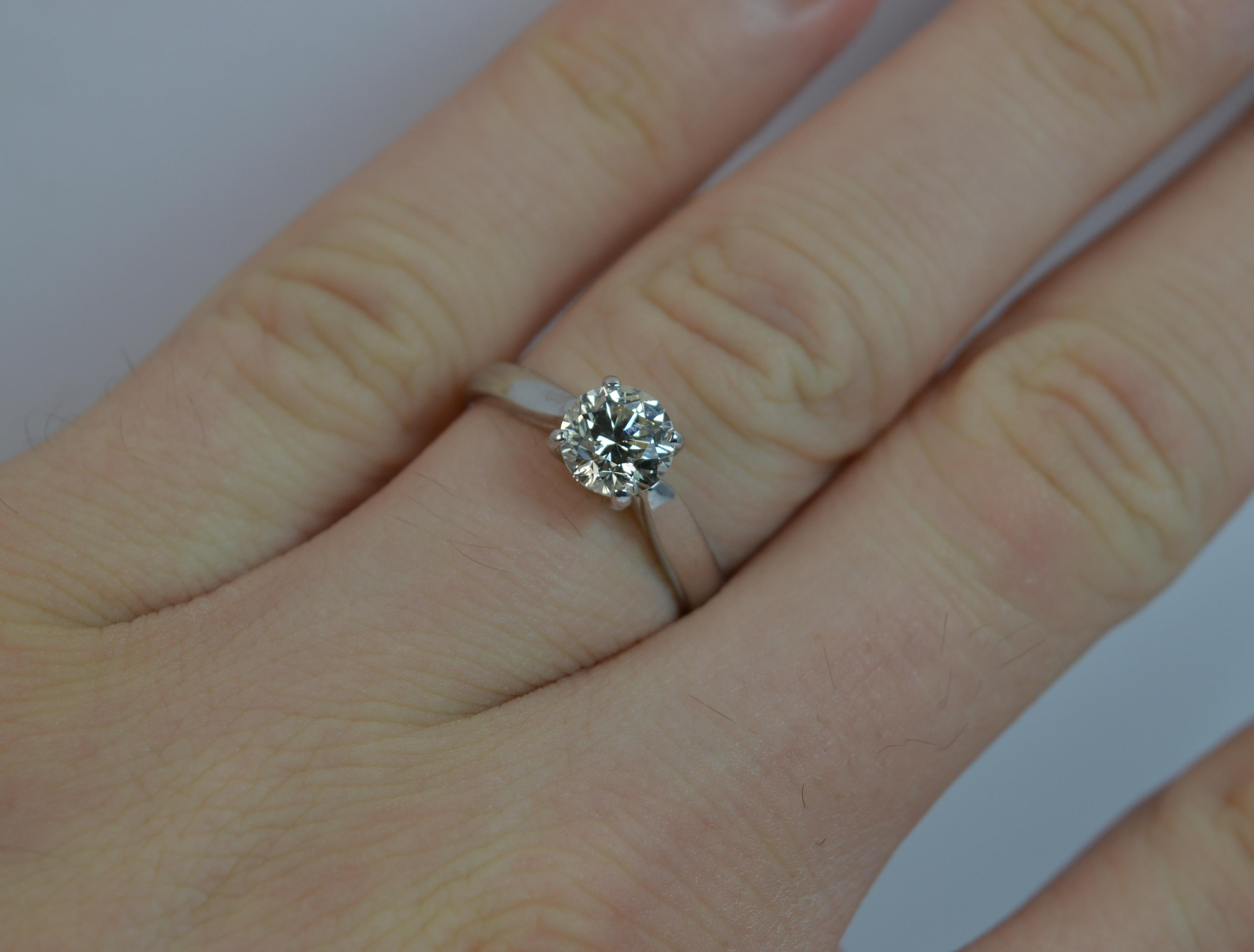 A natural diamond solitaire engagement ring.

​The round brilliant cut diamond measures 6.15mm in diameter and weighs 1.00 carats as marked to the shank.

​The diamond is a sparkly example in four claw setting. Protruding 6mm off the finger. Very