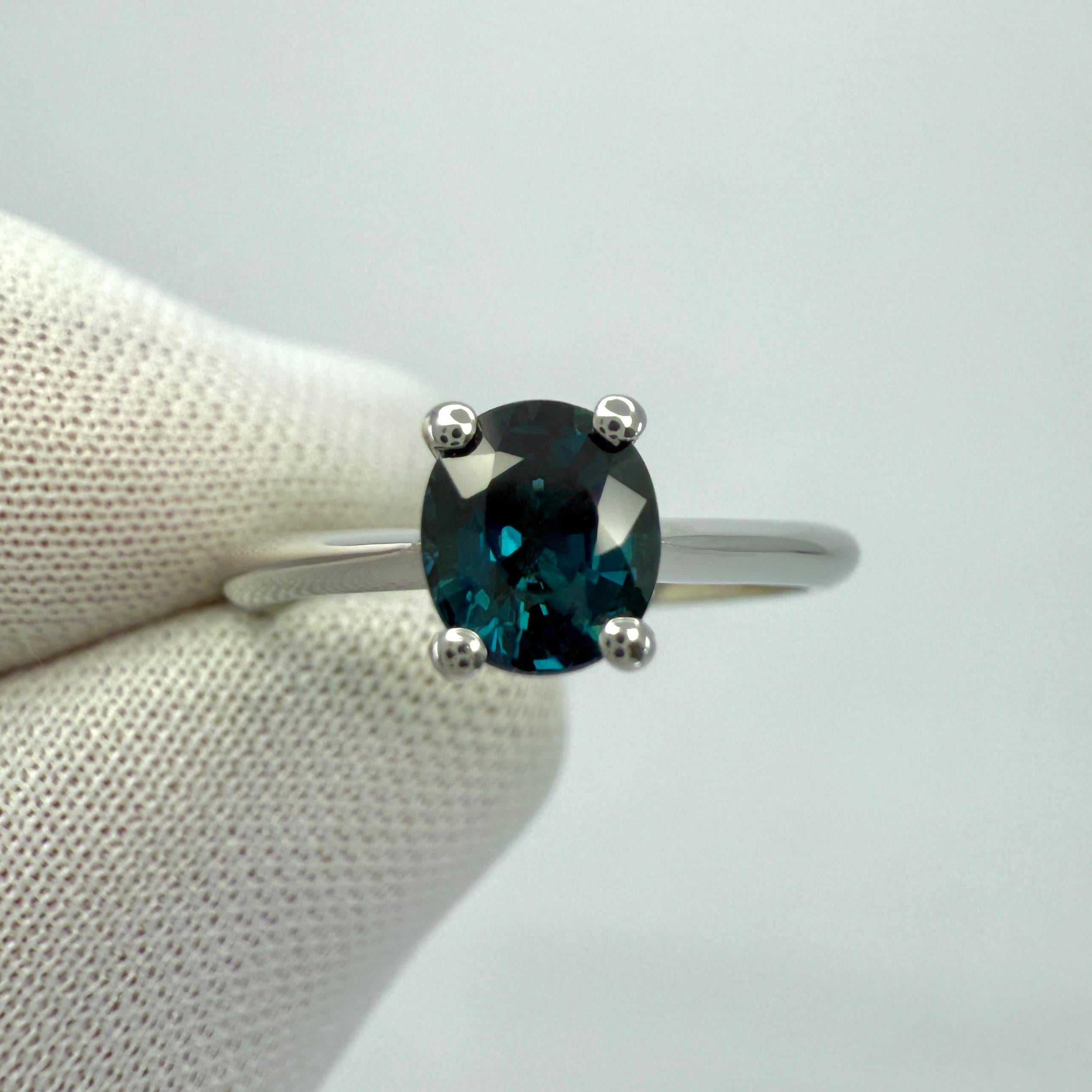 Natural Deep Teal Blue Sapphire 950 Platinum Solitaire Ring.

1.00 Carat sapphire with a beautiful deep teal blue colour.
The sapphire also has very good clarity, very clean stone with only some small natural inclusions visible when looking closely.
