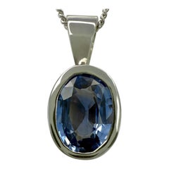 Ciondolo Rubover di platino 950 con zaffiro azzurro naturale da 1,00ct, taglio ovale.