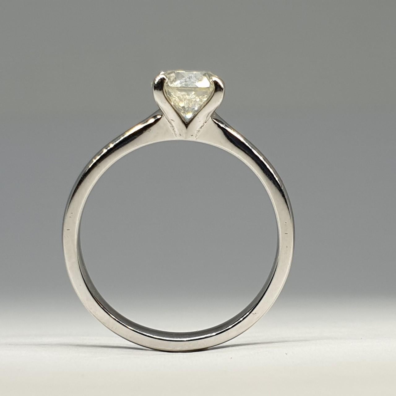 Natural round cut diamond set in a beautiful 18k white gold solitaire ring.

1.01 carat stone with an excellent round brilliant cut. Si1 clarity and H colour.

Comes with certificate of valuation for £12,450

Ring size M. The ring is