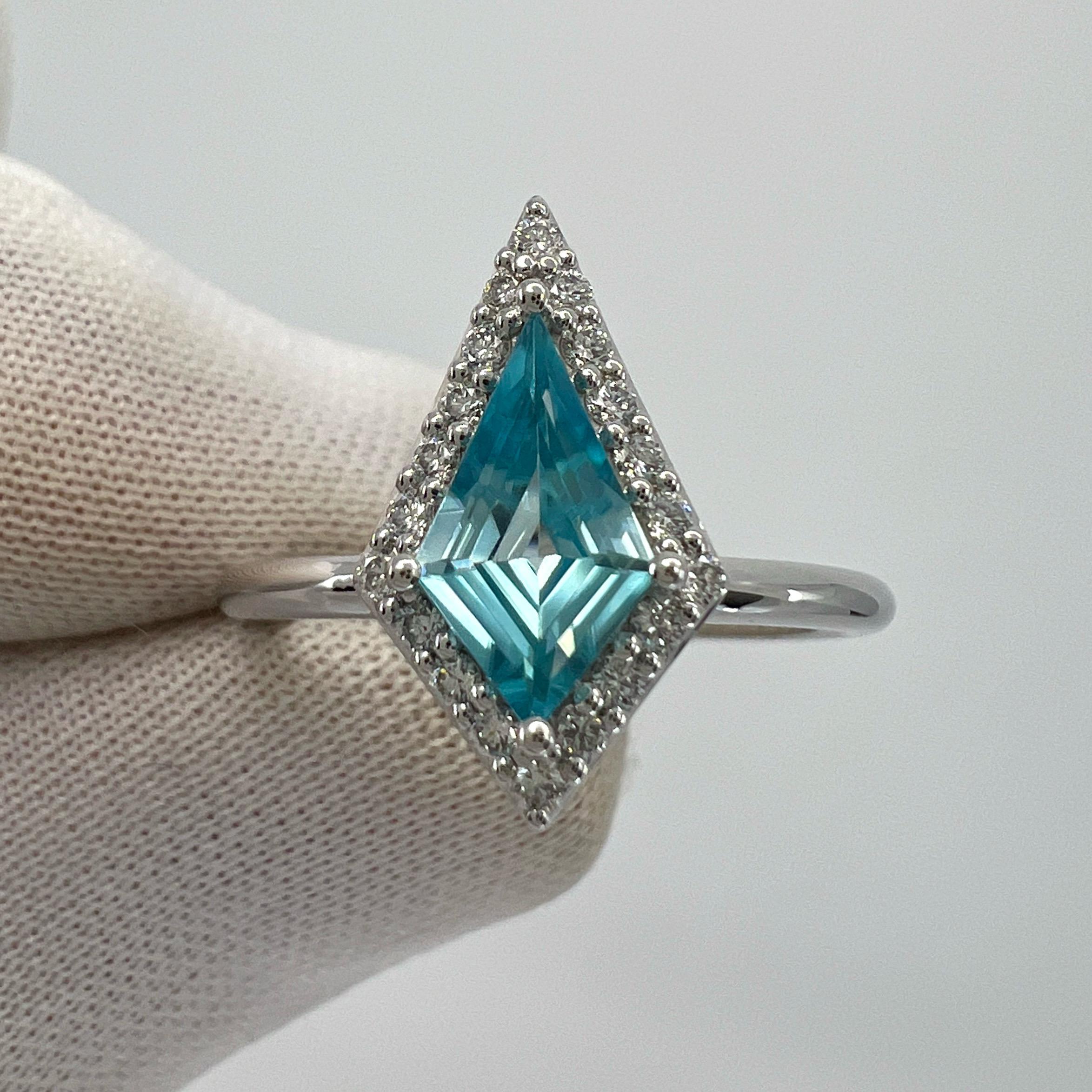 Natural Vivid Blue Zircon Fancy Kite Cut 18k White Gold Diamond Halo Ring.

1.07 Carat natural zircon with a unique fancy kite cut and stunning vivid blue colour. Also has excellent clarity. Very clean stone.

This unique gem is set in a beautiful