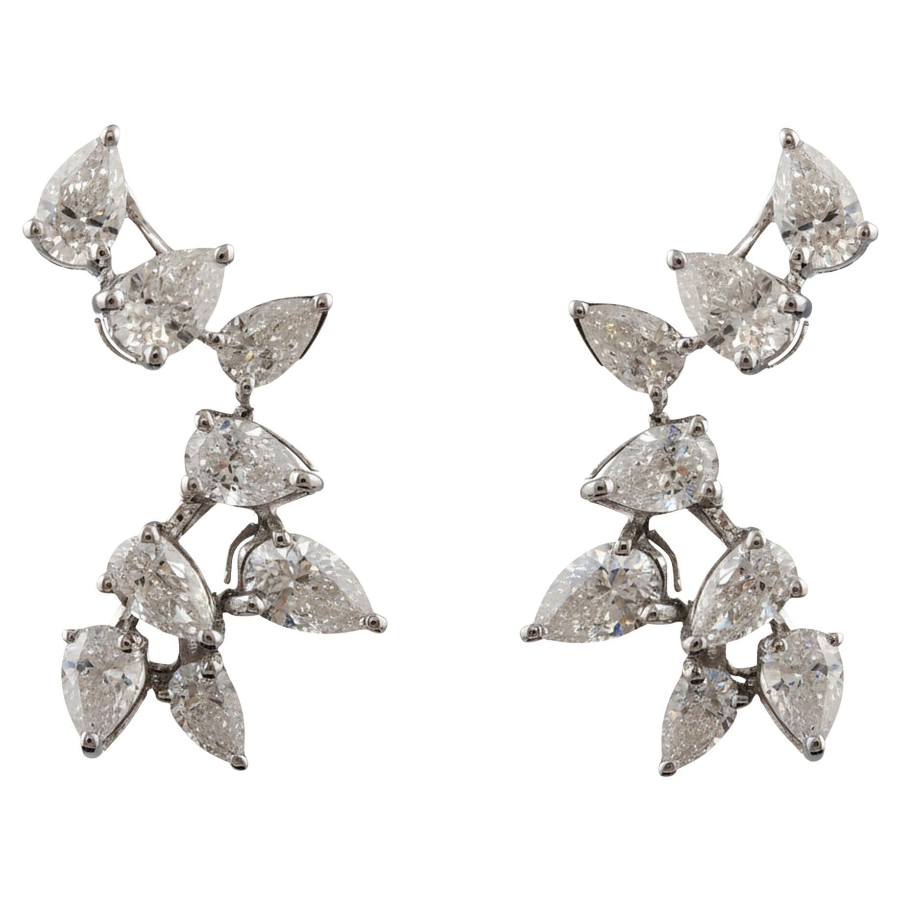 Boucles d
oreilles en diamant poire Nature 1.12 carat SI Clarity HI Color 18 Karat White Gold