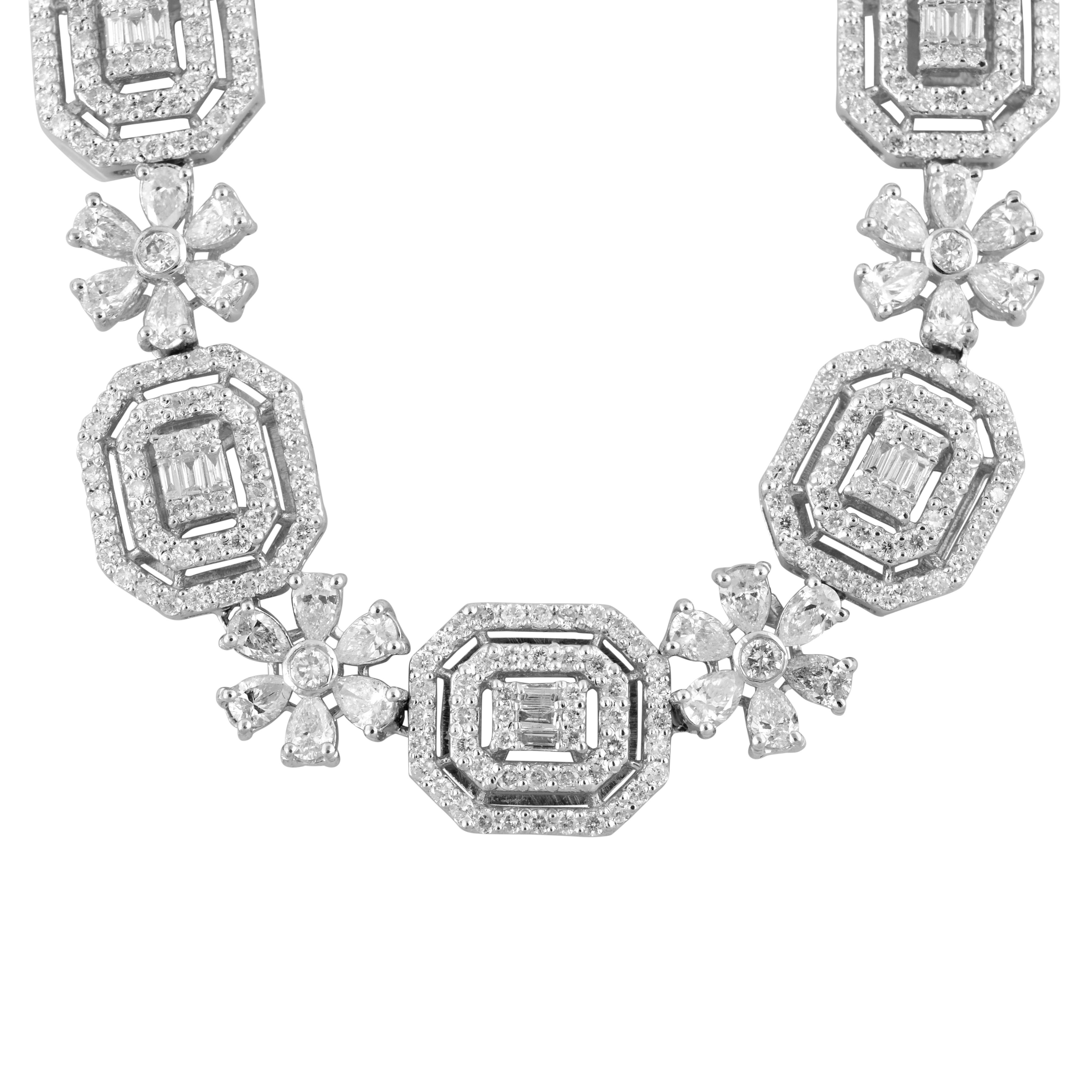Introducing our handmade jewelry masterpiece: a natural 11.20-carat diamond charm necklace, made in 18-karat white gold.
The focal point of this necklace is an impressive collection of diamonds, carefully selected for their exceptional quality and