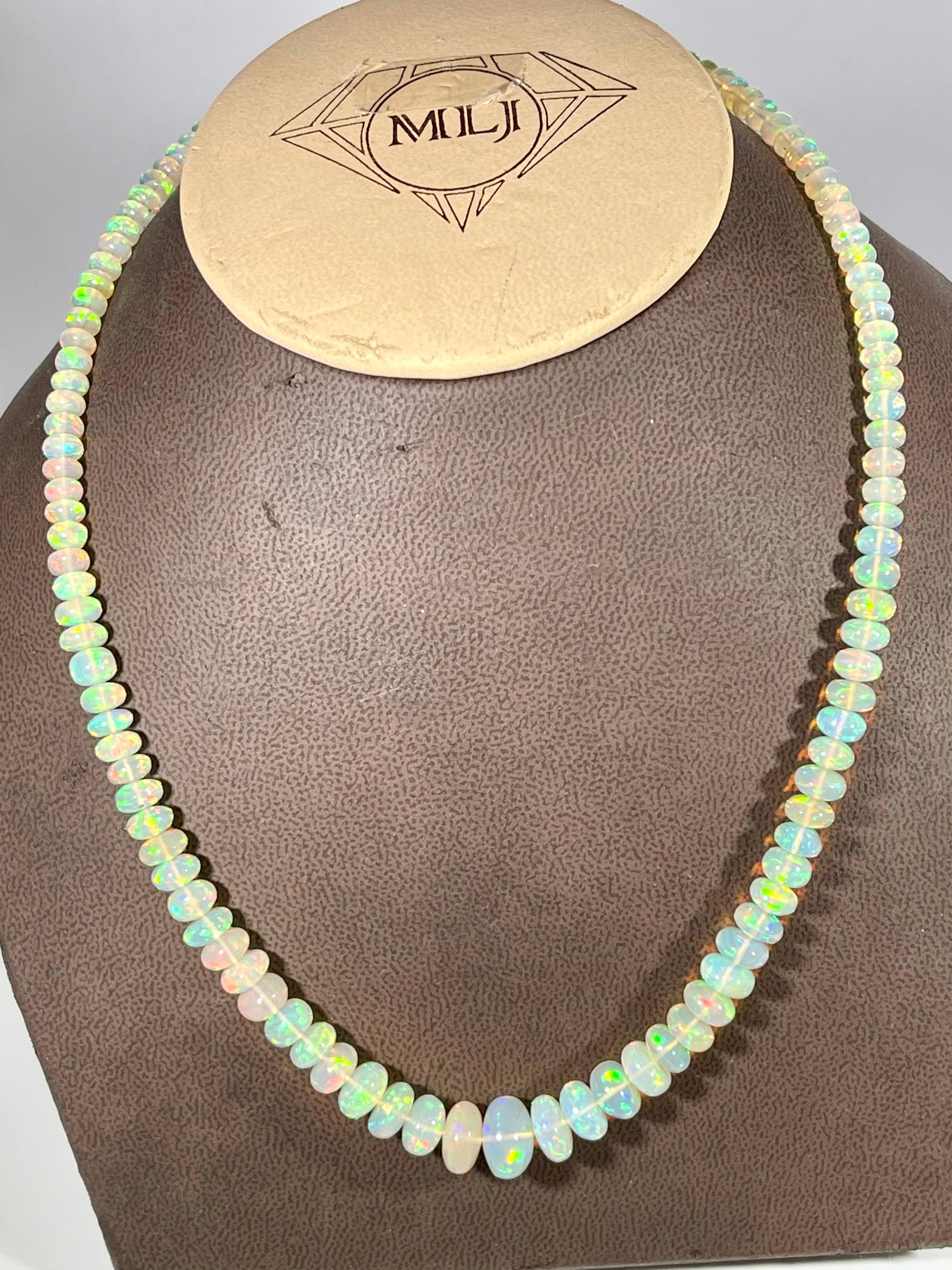  Natural Opal single strand Bead Necklace with 14 Karat lobster gold Clasp. These are Ethiopian Beads
20 to 21 inch long 
1 layers of Natural opal  Beads
These are Smooth beads , have  very much  Luster and shine
Beautiful color reflection of red ,