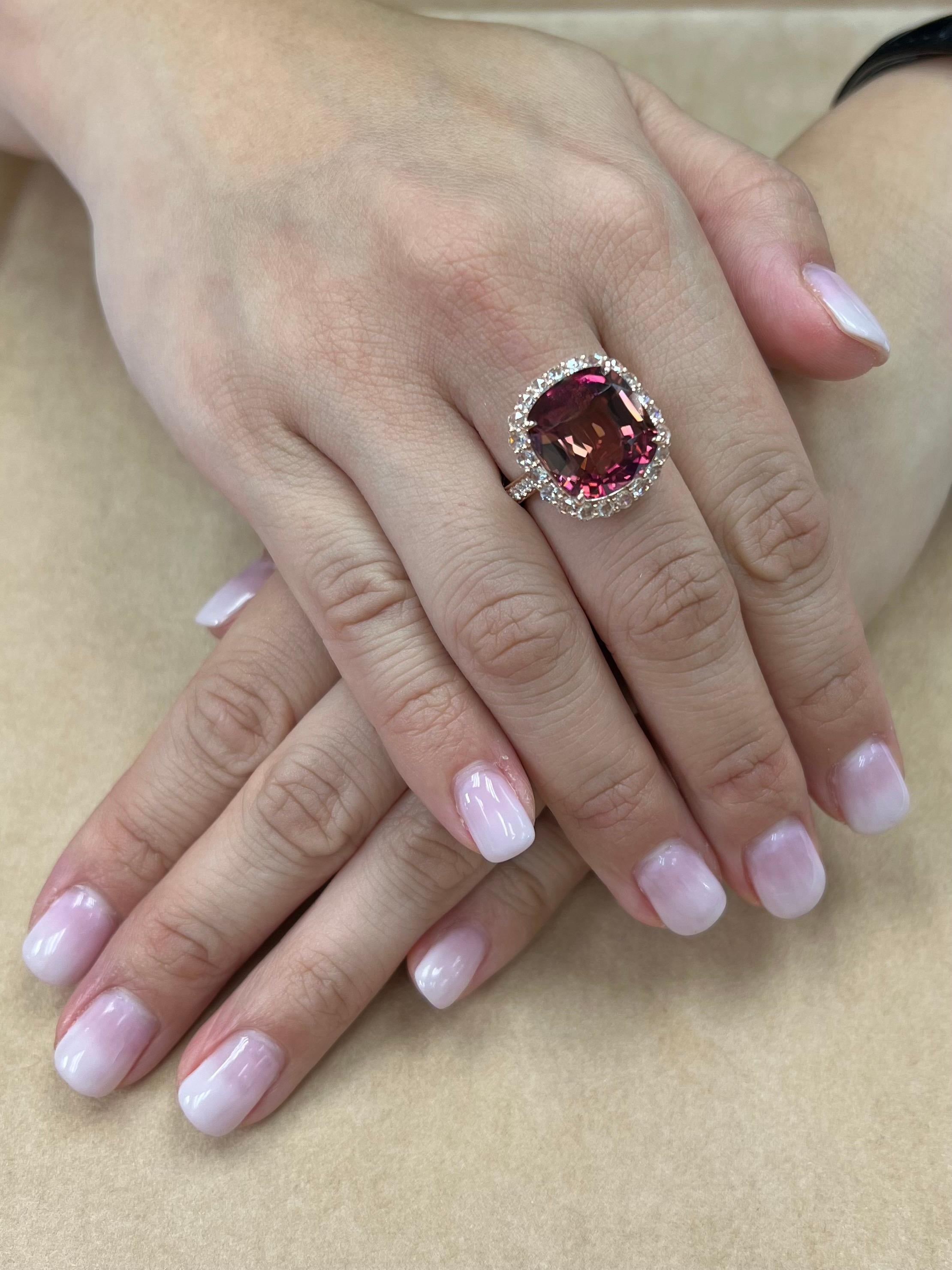 Please check out the HD video! Here is a large oversized 11.55 cts pink tourmaline ring. There are 22 new rose cut diamonds (0.83cts) forming a halo surrounding the center orange pink tourmaline. On the shank of the ring are 12 full cut diamonds